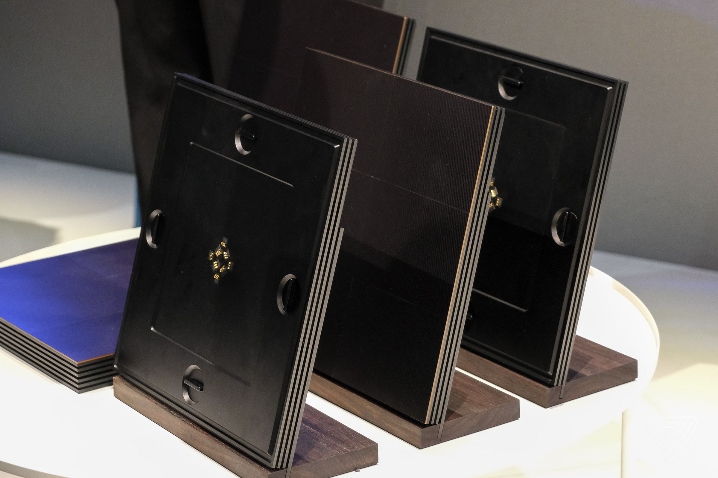 At left: one of Samsung’s MicroLED back plates, which link together with metal hooks and then hold the front display tiles magnetically.