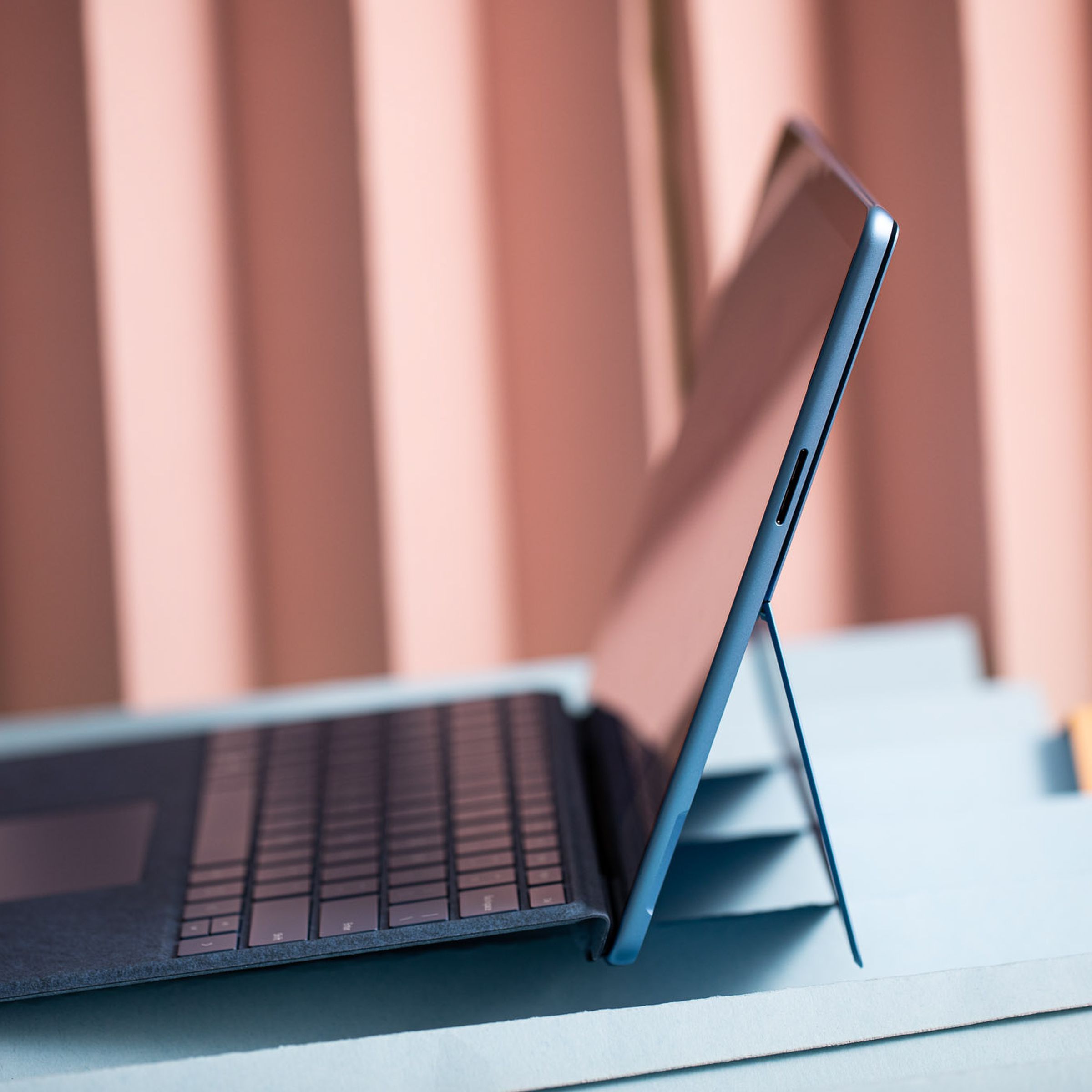 The Surface Pro 9 in laptop mode seen from the left side.