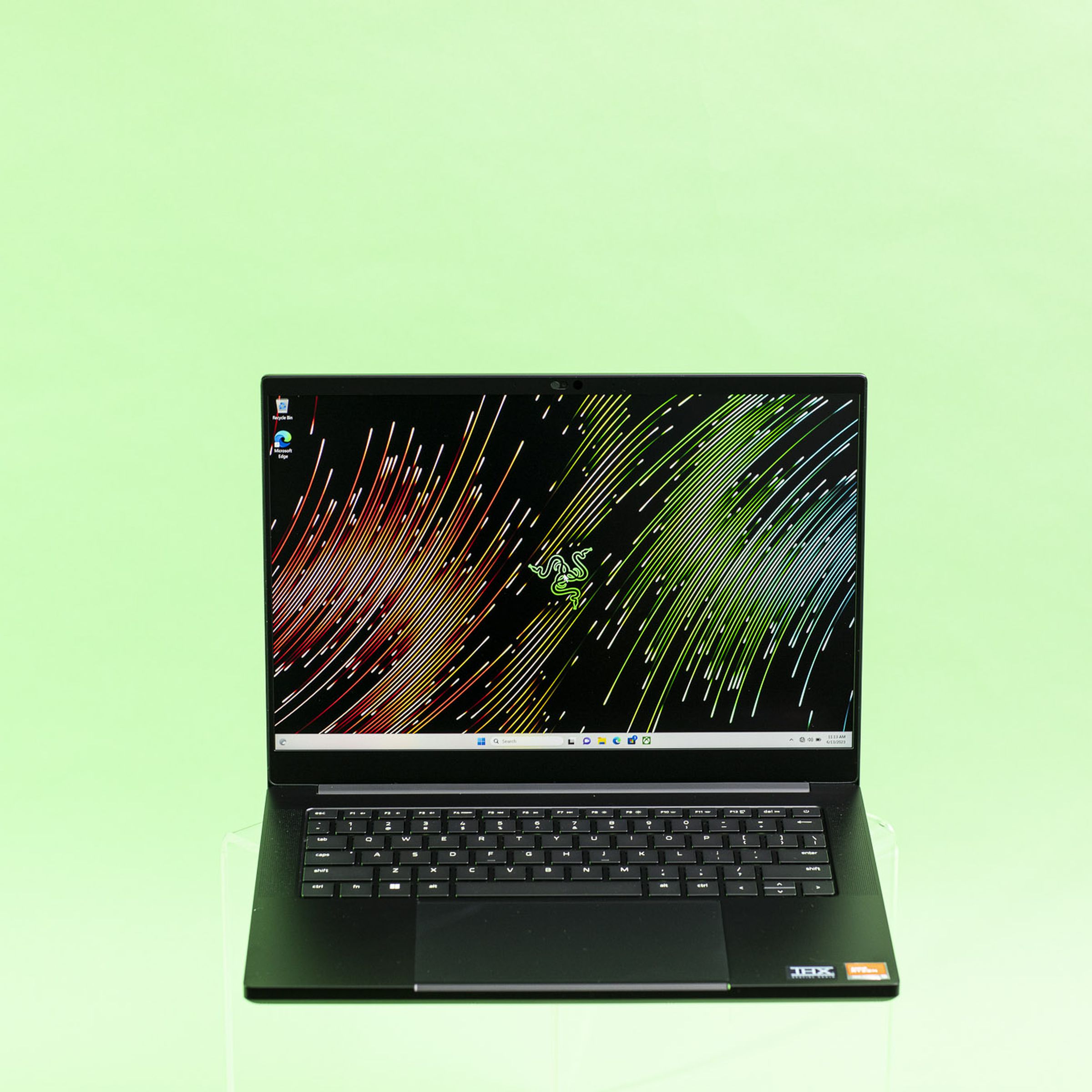 Razer Blade 14 seen from the front on a green background.
