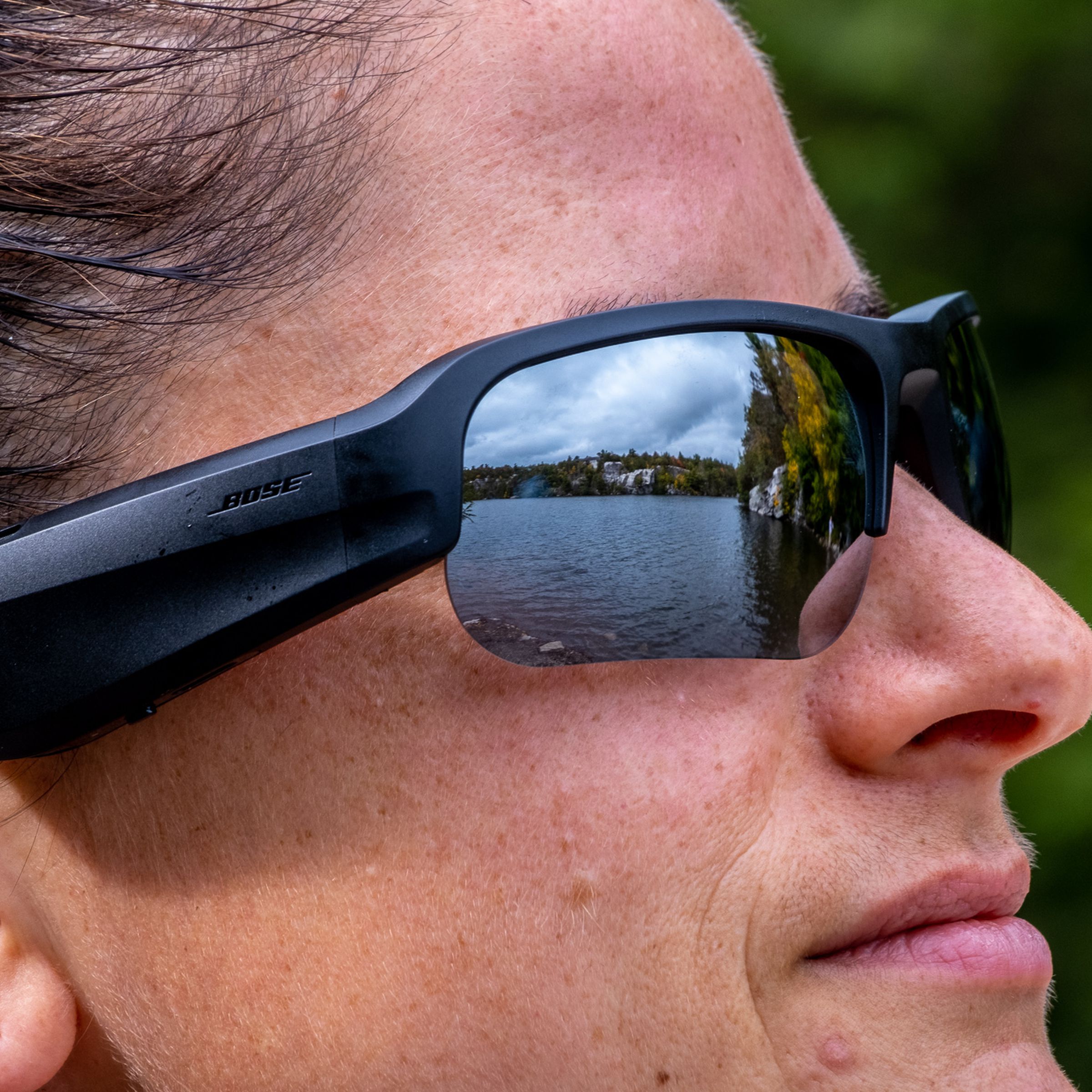 A photo of Bose’s Frames Tempo audio sunglasses on a woman’s face.