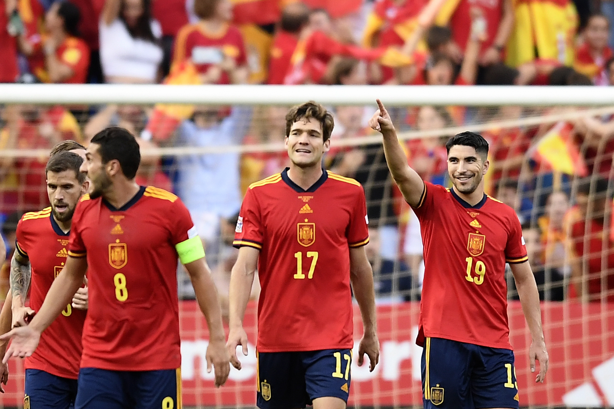 Spains Carlos Soler, right, celebrates after scoring the opening goal