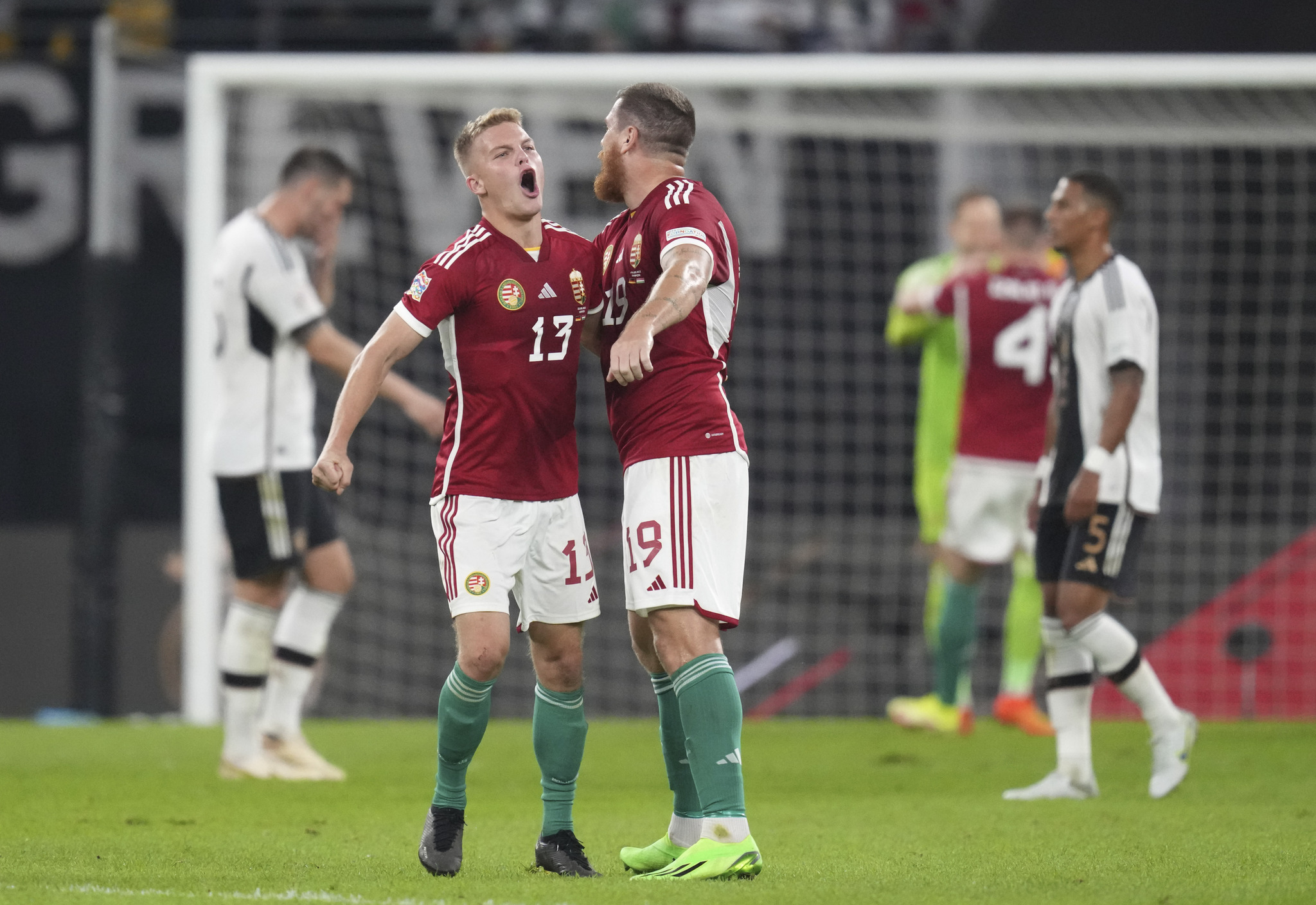 Hungarys Andras Schafer, left, and Hungarys Martin �d�m celebrate victory