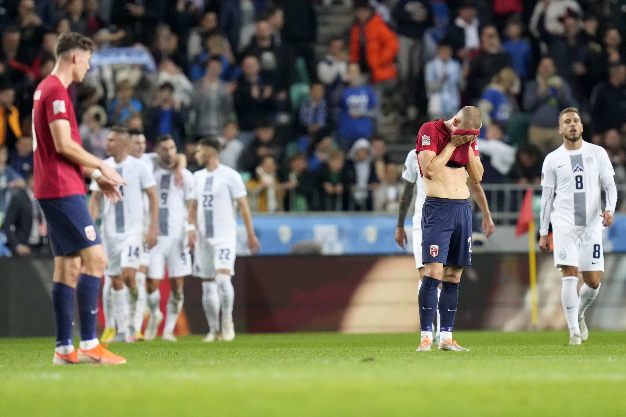 Norwegian players react after Slovenia scored their sides second goal