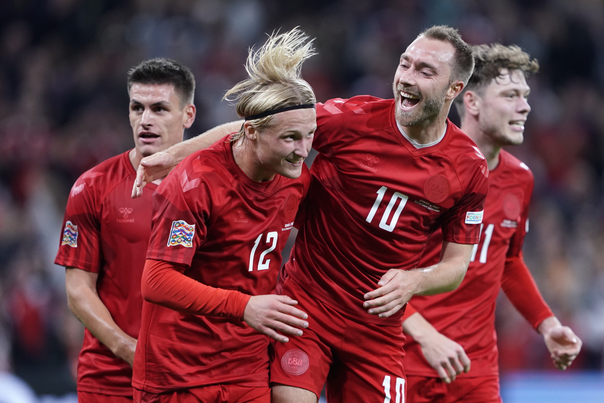 Denmarks Kasper Dolberg (L) celebrates with Christian Eriksen