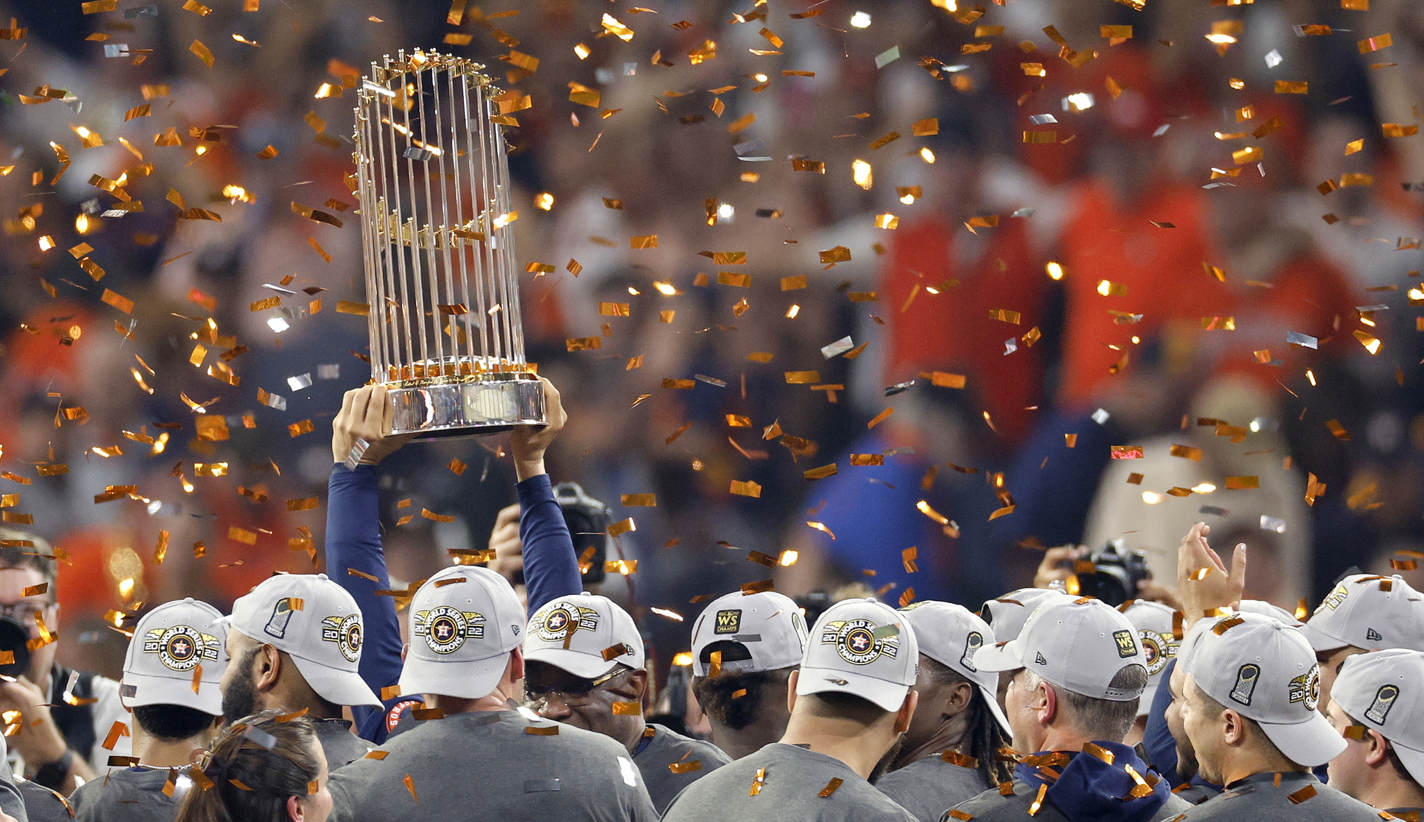 The Astros lift their trophy.