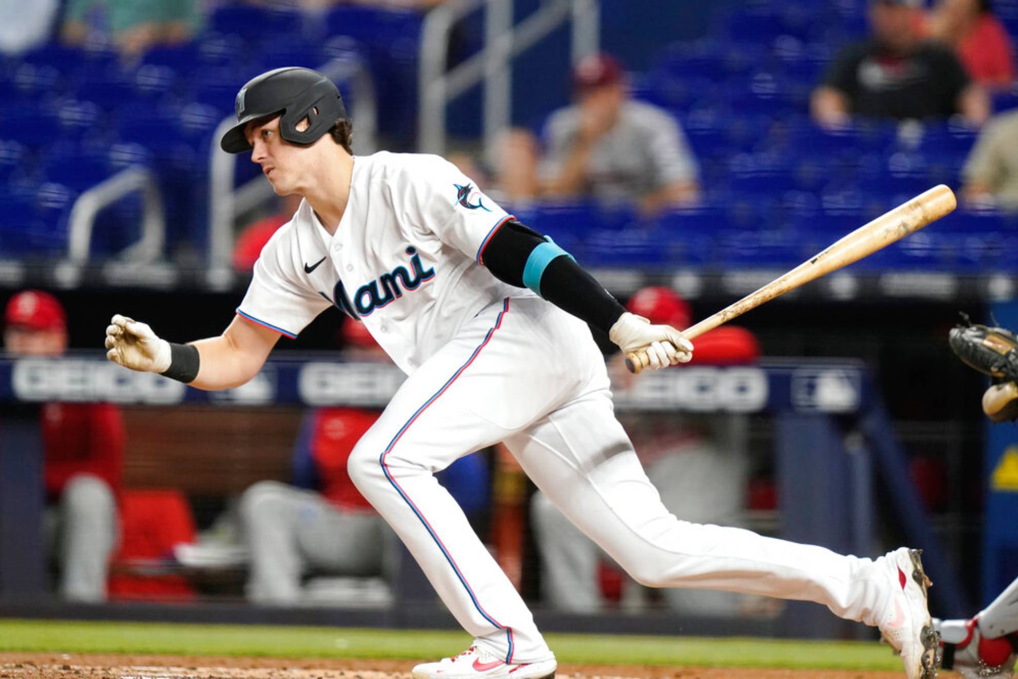 Miami Marlins Brian Anderson follows through after hitting a single during the first inning of a baseball game against the Philadelphia Phillies