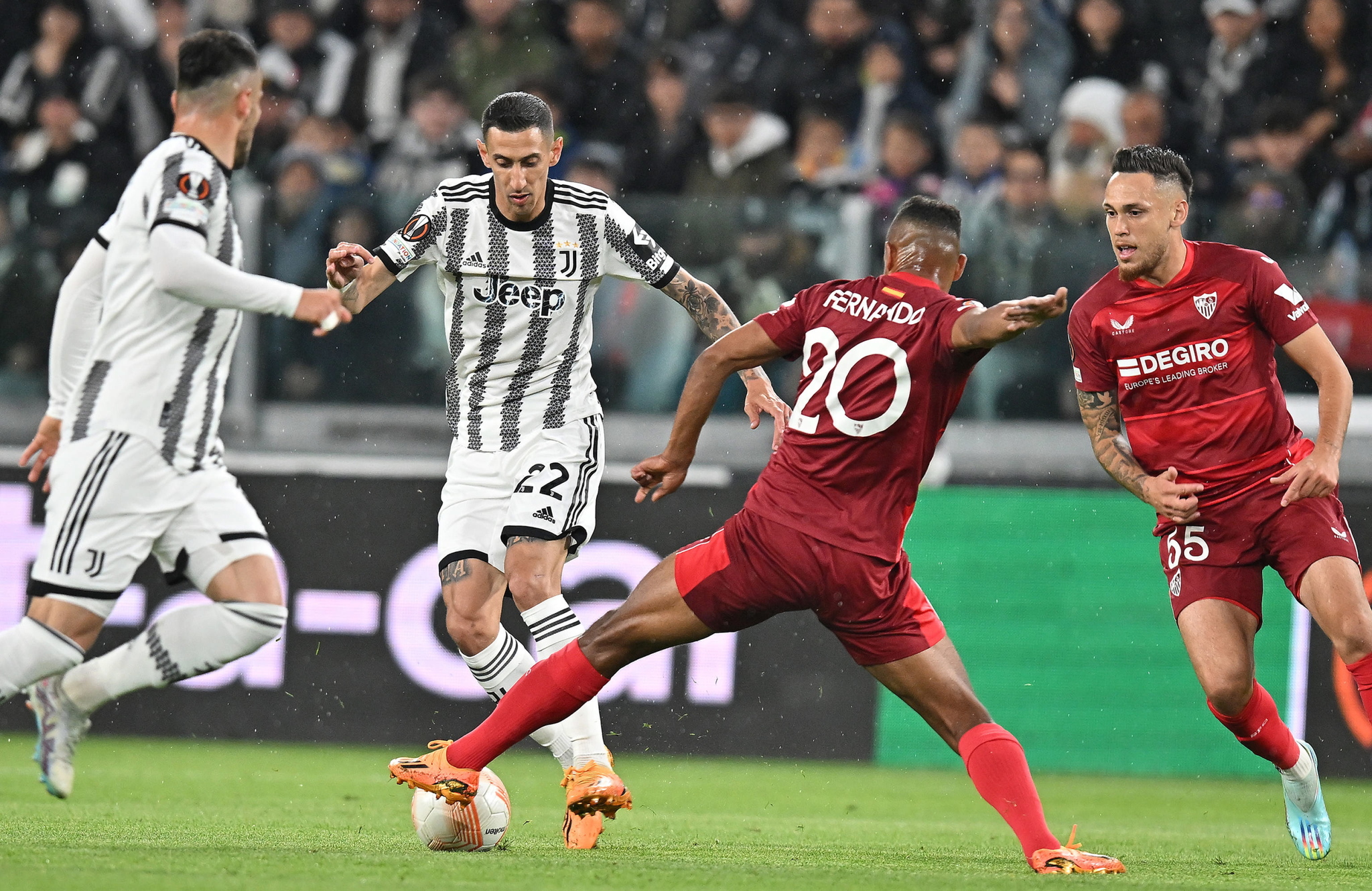 Di Maria and Fernando battle for the ball.