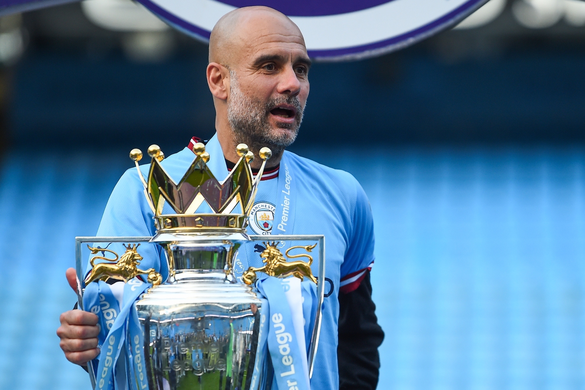 Pep Guardiola with the Premier League trophy