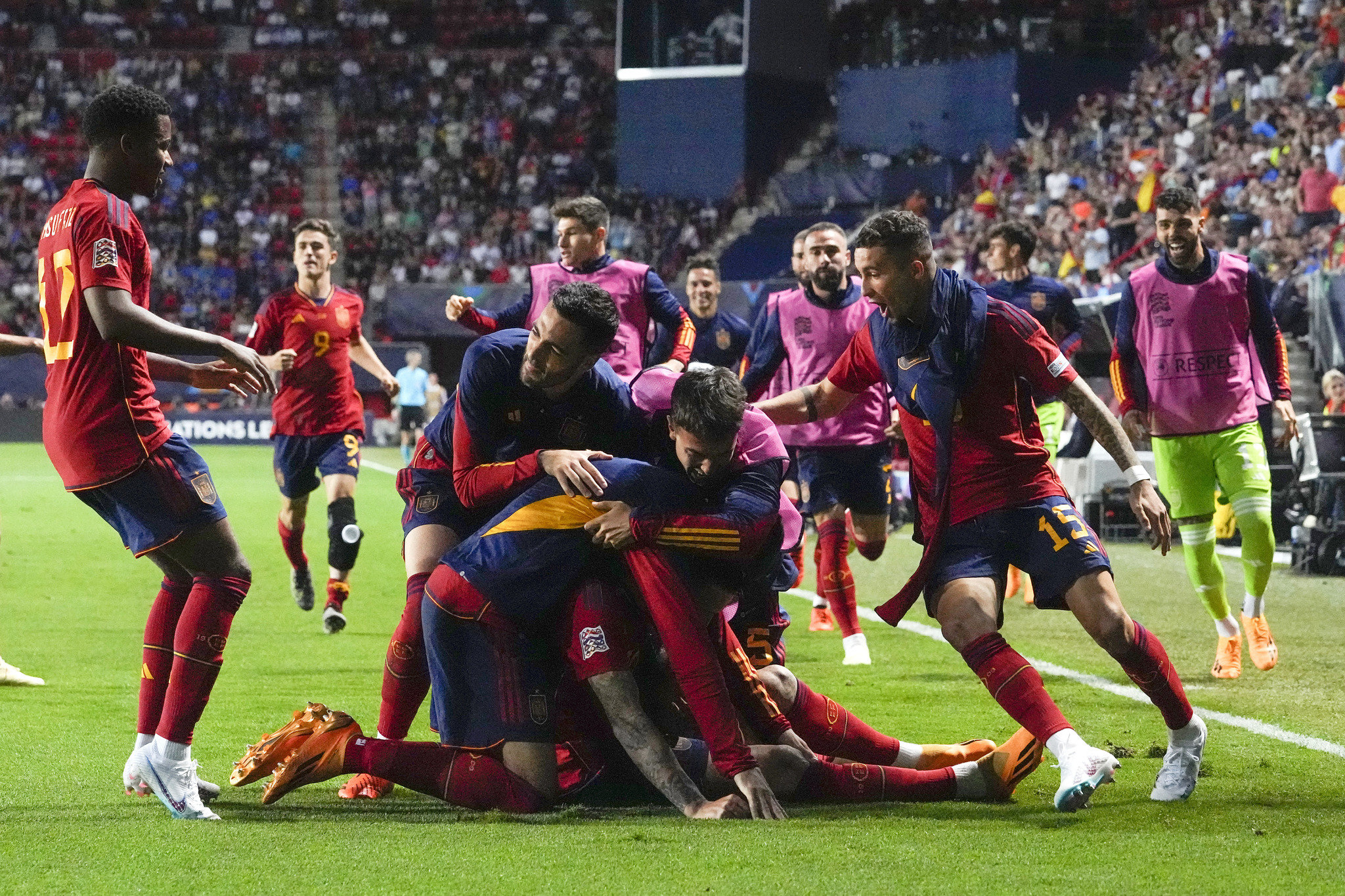 Spain players celebrate after Joselus winner