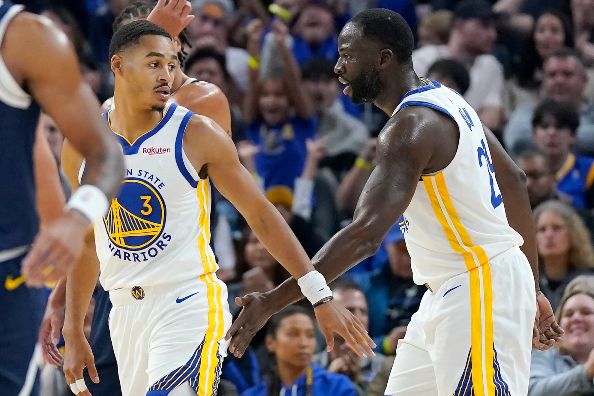 Draymond Green and Jordan Poole at a Warriors game.