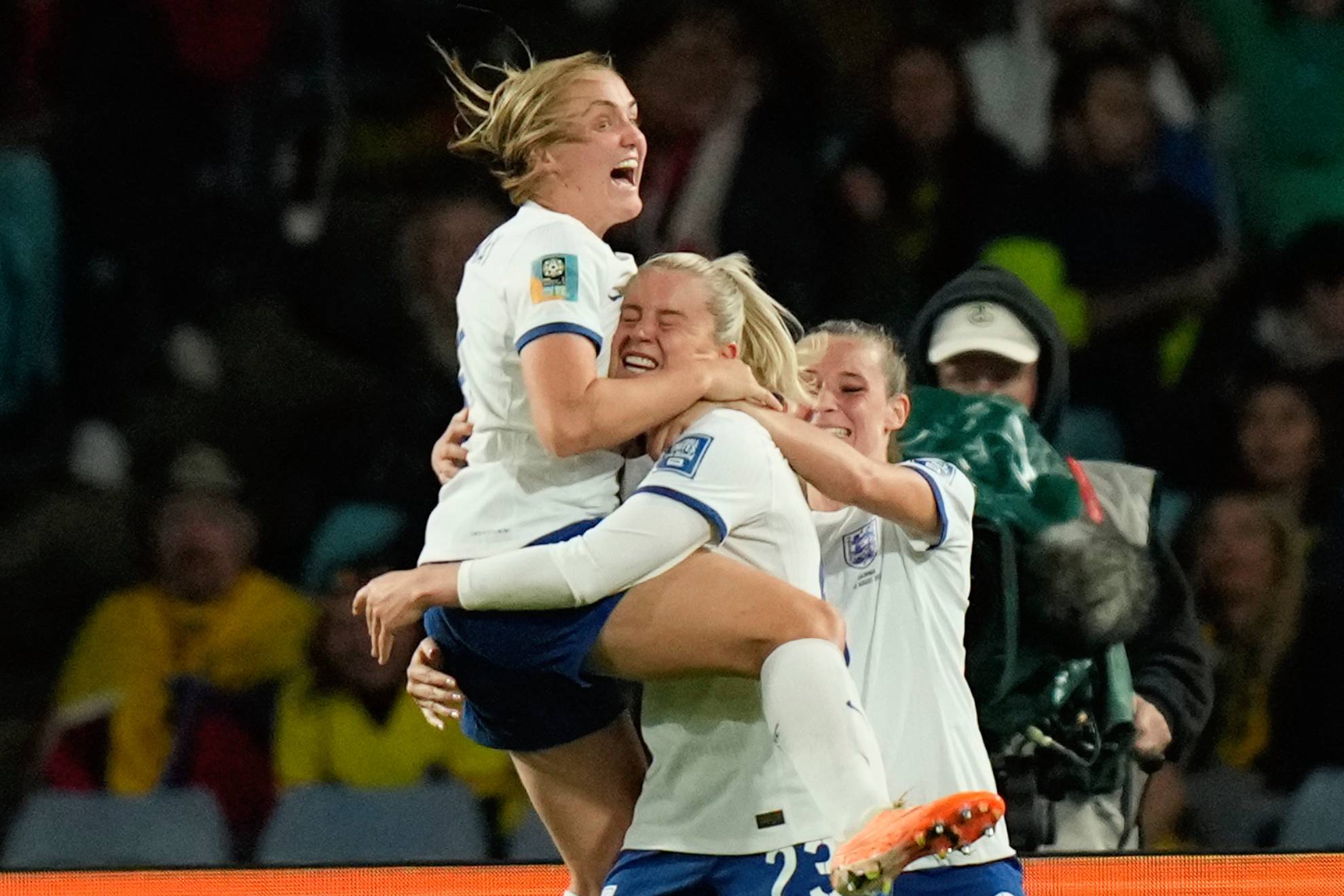 Englands Alessia Russo, center, celebrates after scoring her sides 2nd goal