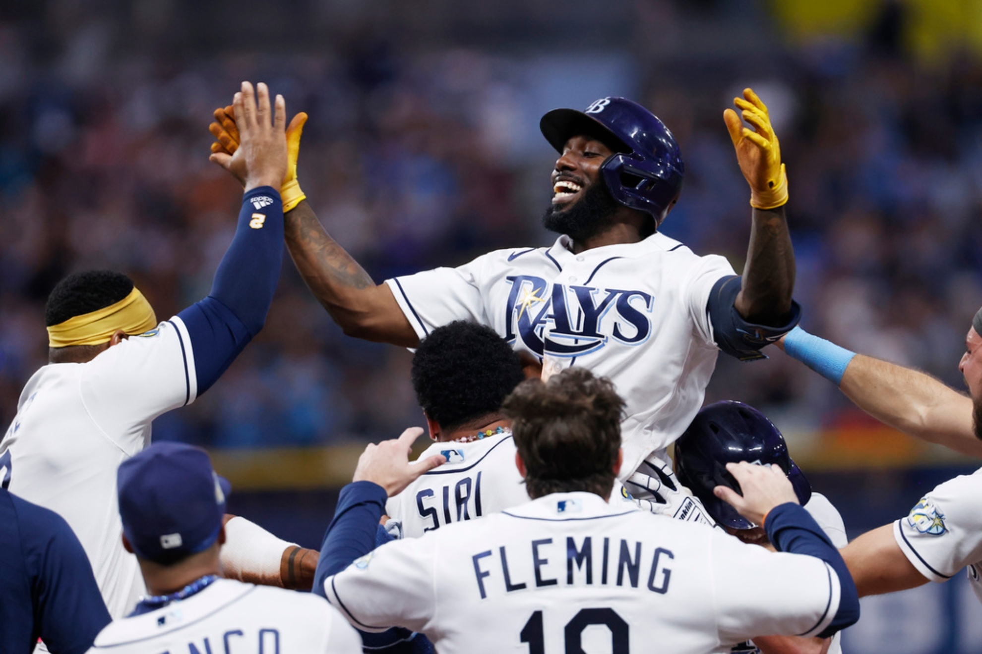 Randy Arozarena gets carried in arms after perfect walk-off hit against the Guardians