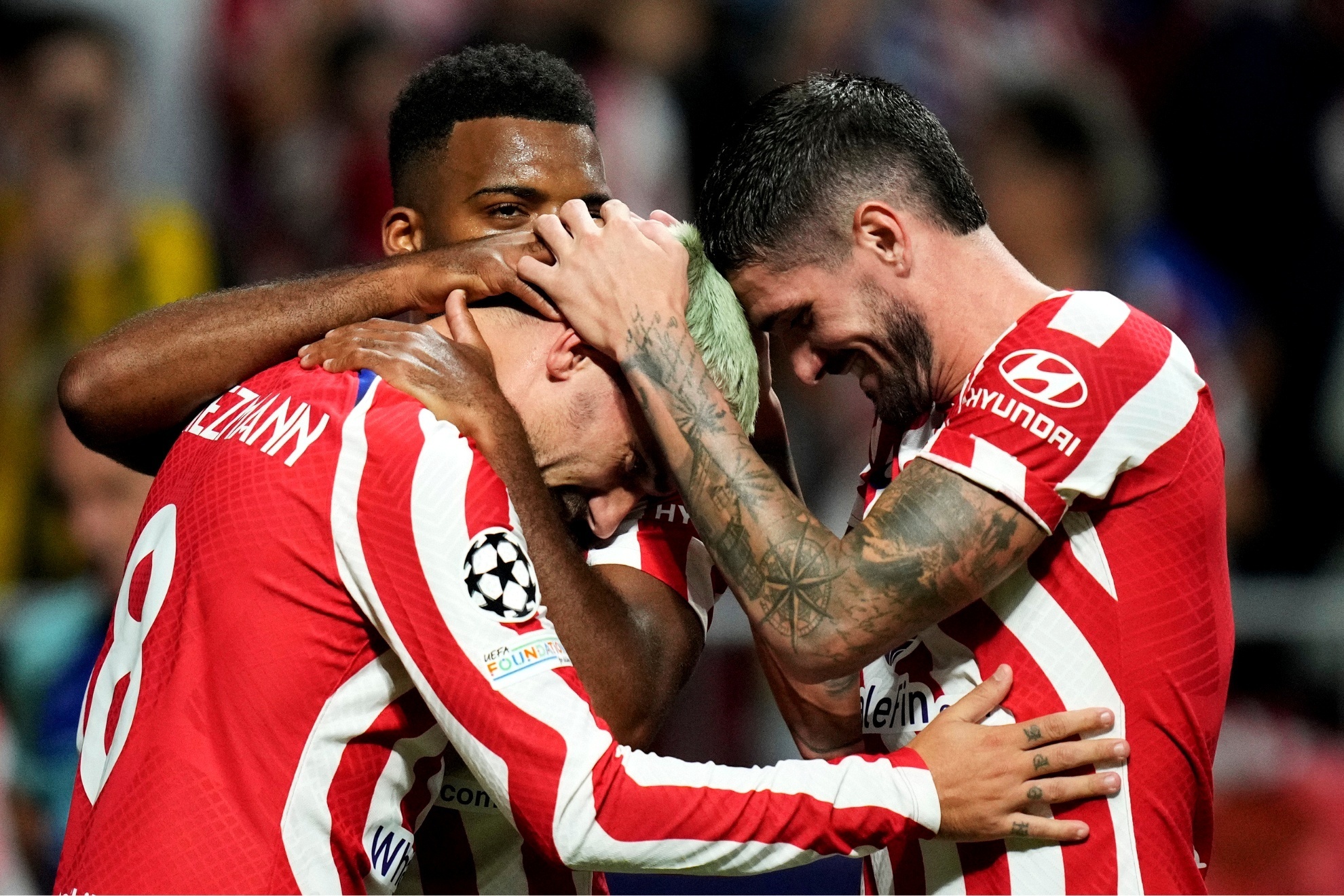 Antoine Griezmann and Rodrigo De Paul celebrate an Atletico Madrid goal together.