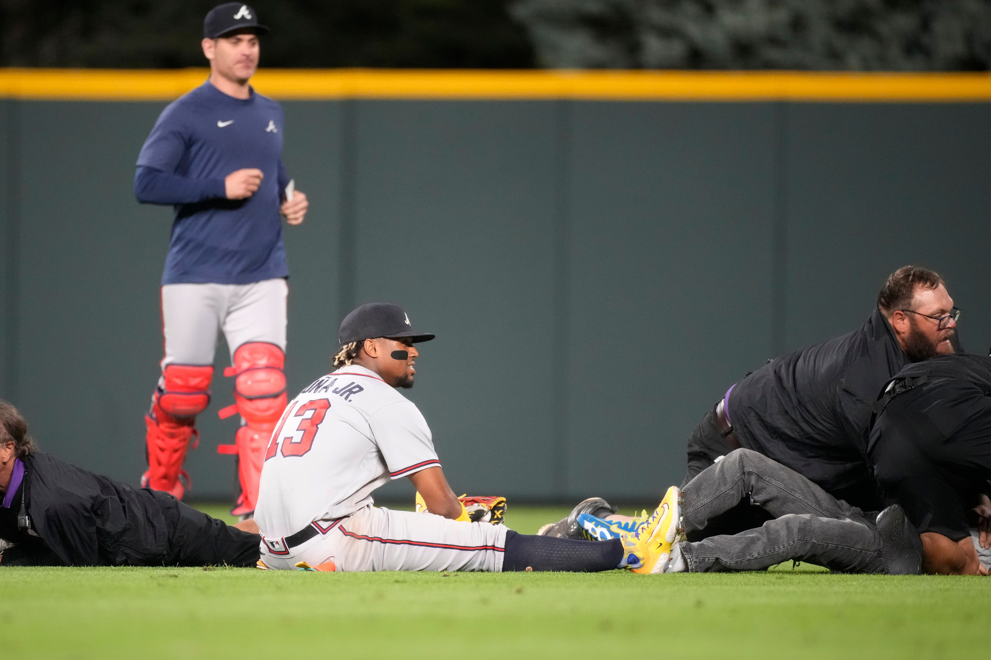 The aftermath: Security takes down the fans who stormed Acu�a.