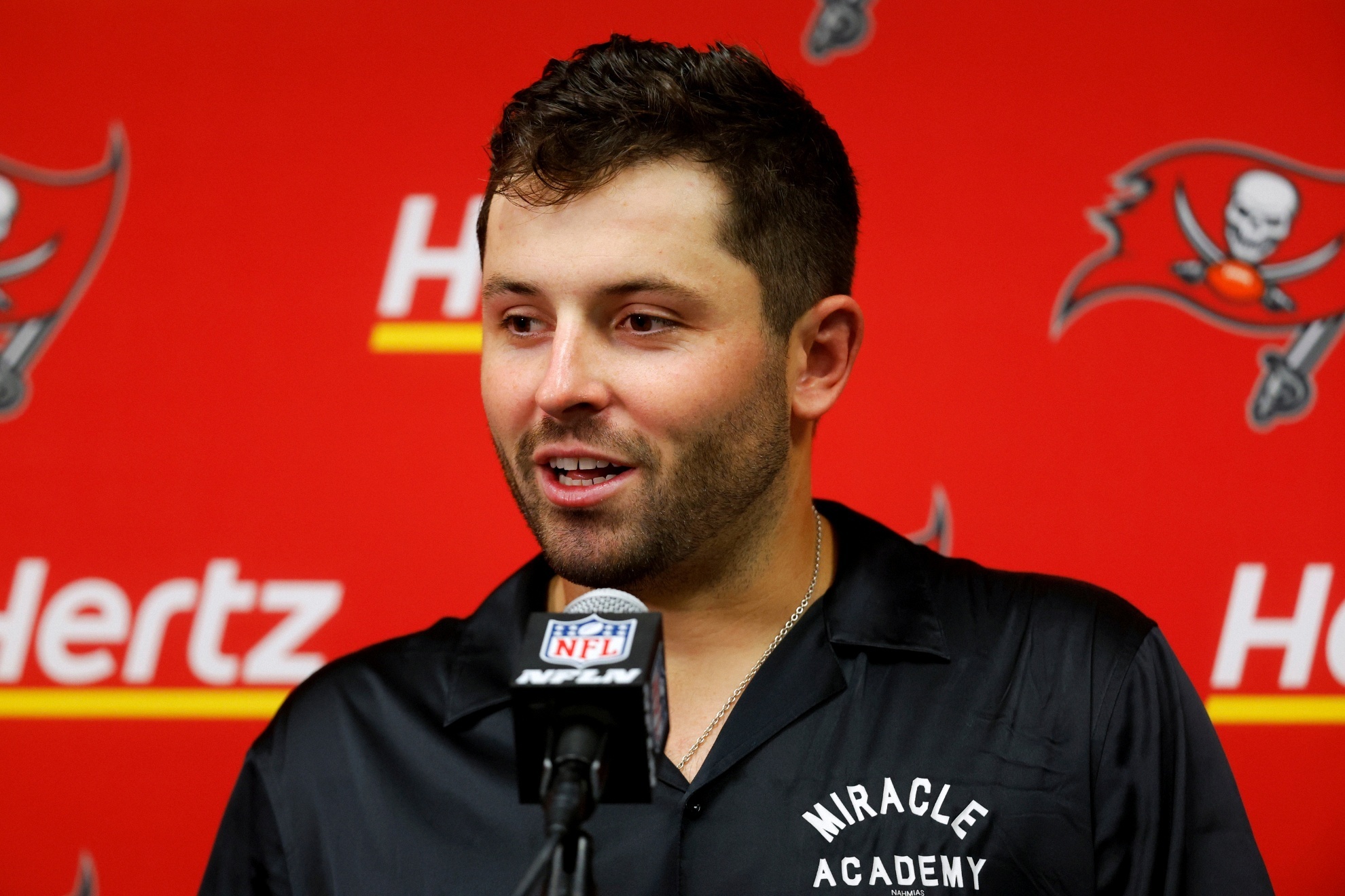 Baker Mayfield speaks at a press conference.