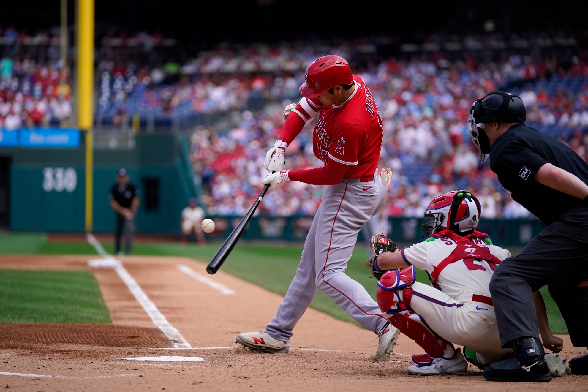 Shohei Ohtani hitting a baseball