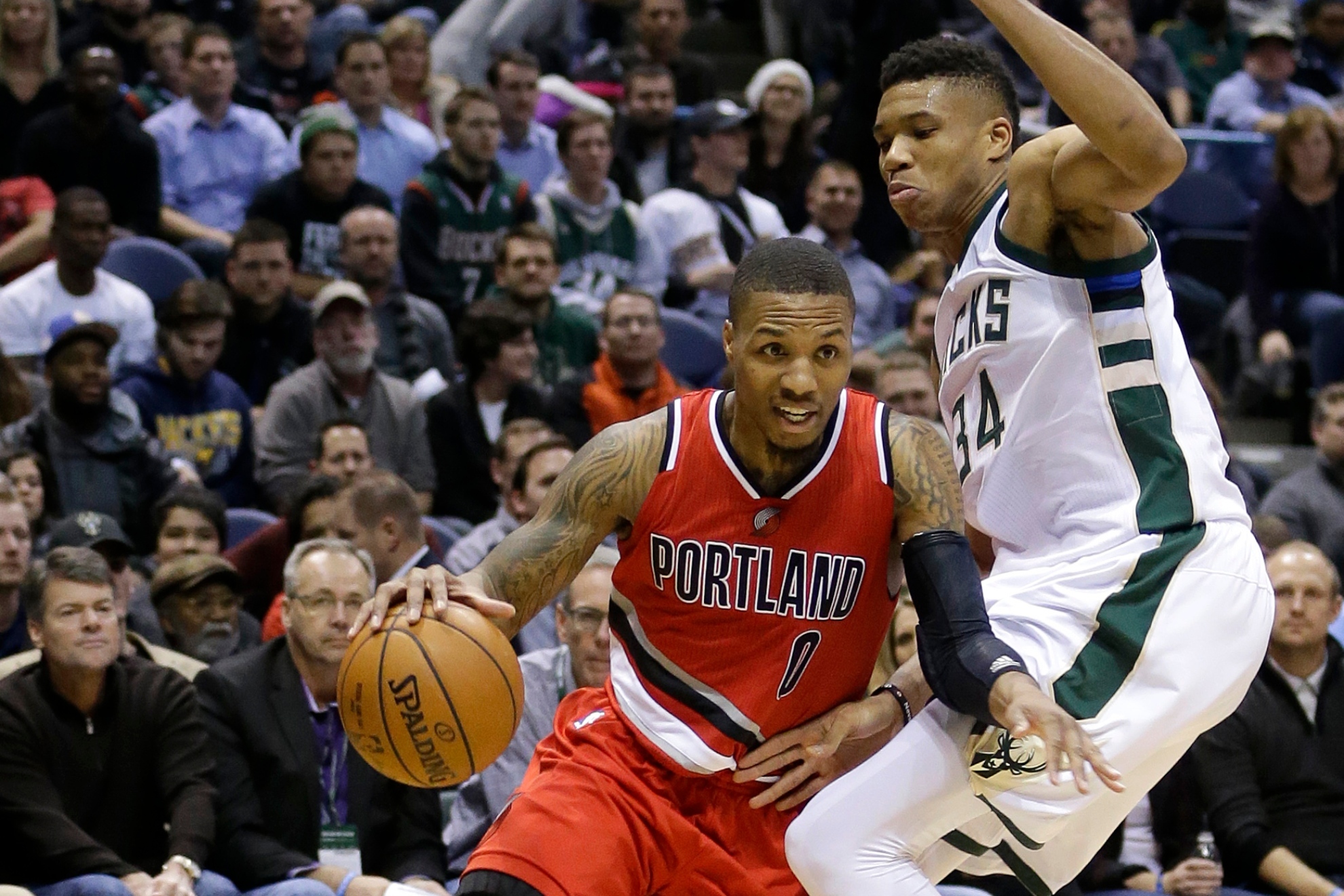 Giannis Antetokounmpo guards Damian Lillard