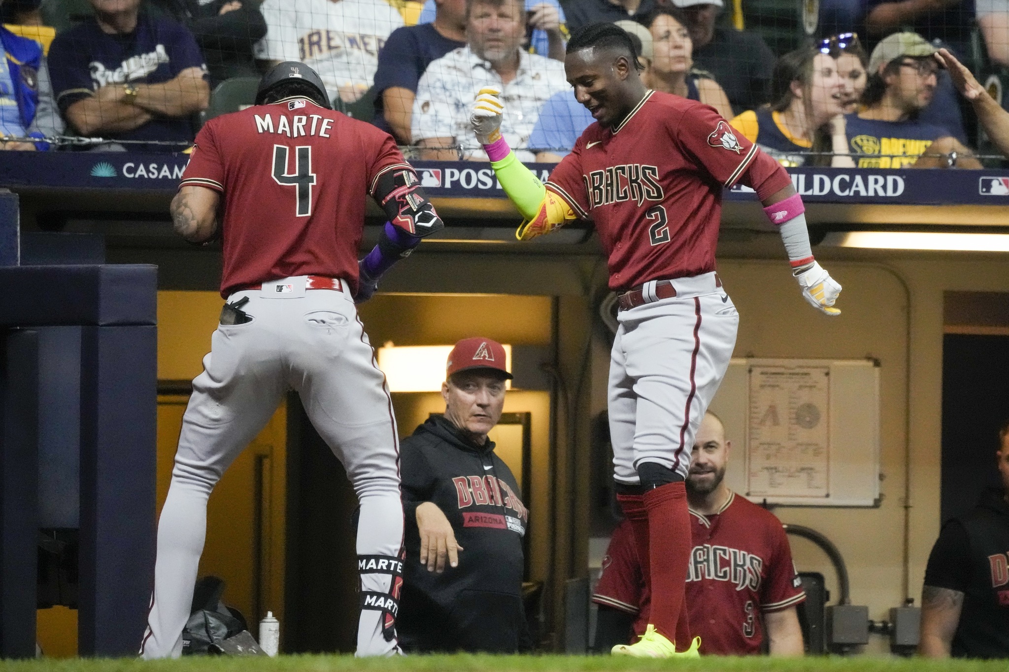 Arizona Diamondbacks Ketel Marte celebrates his HR with Geraldo Perdomo during Game 1 of their NL wildcard game against the Milwaukee Brewers.