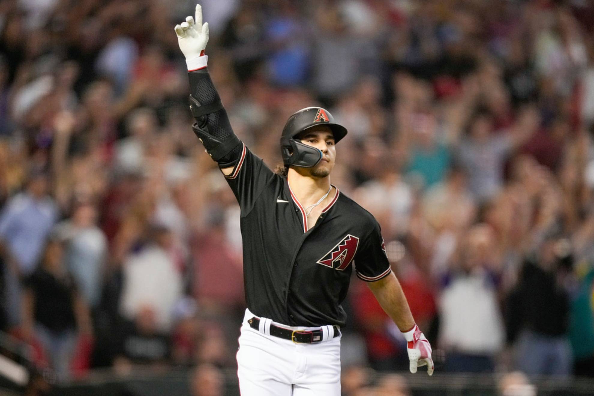 Arizona Diamondbacks Alek Thomas rounds the bases after a two-run home