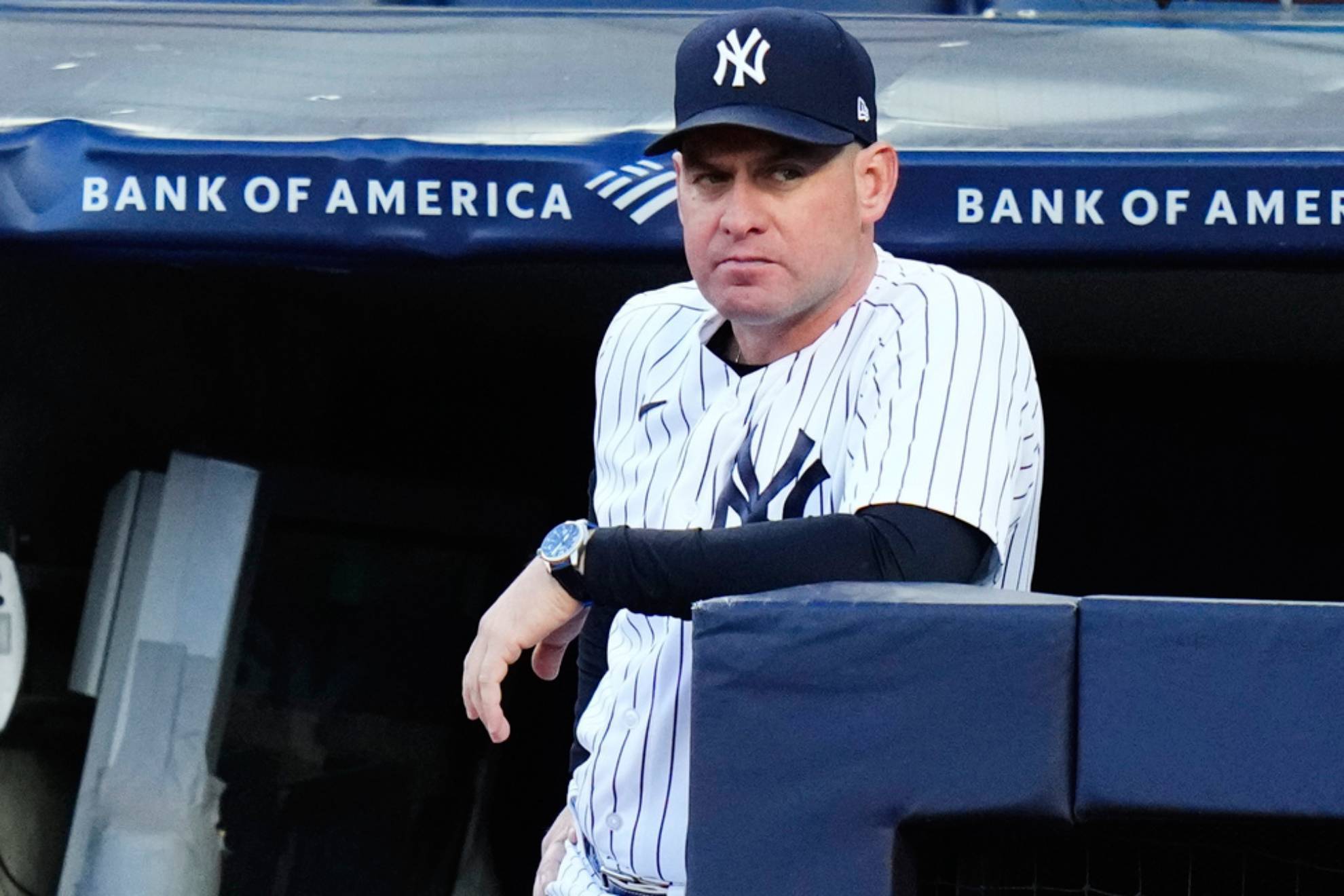 New York Yankees bench coach Carlos Mendoza watches the first inning of a baseball game against the San Diego Padres