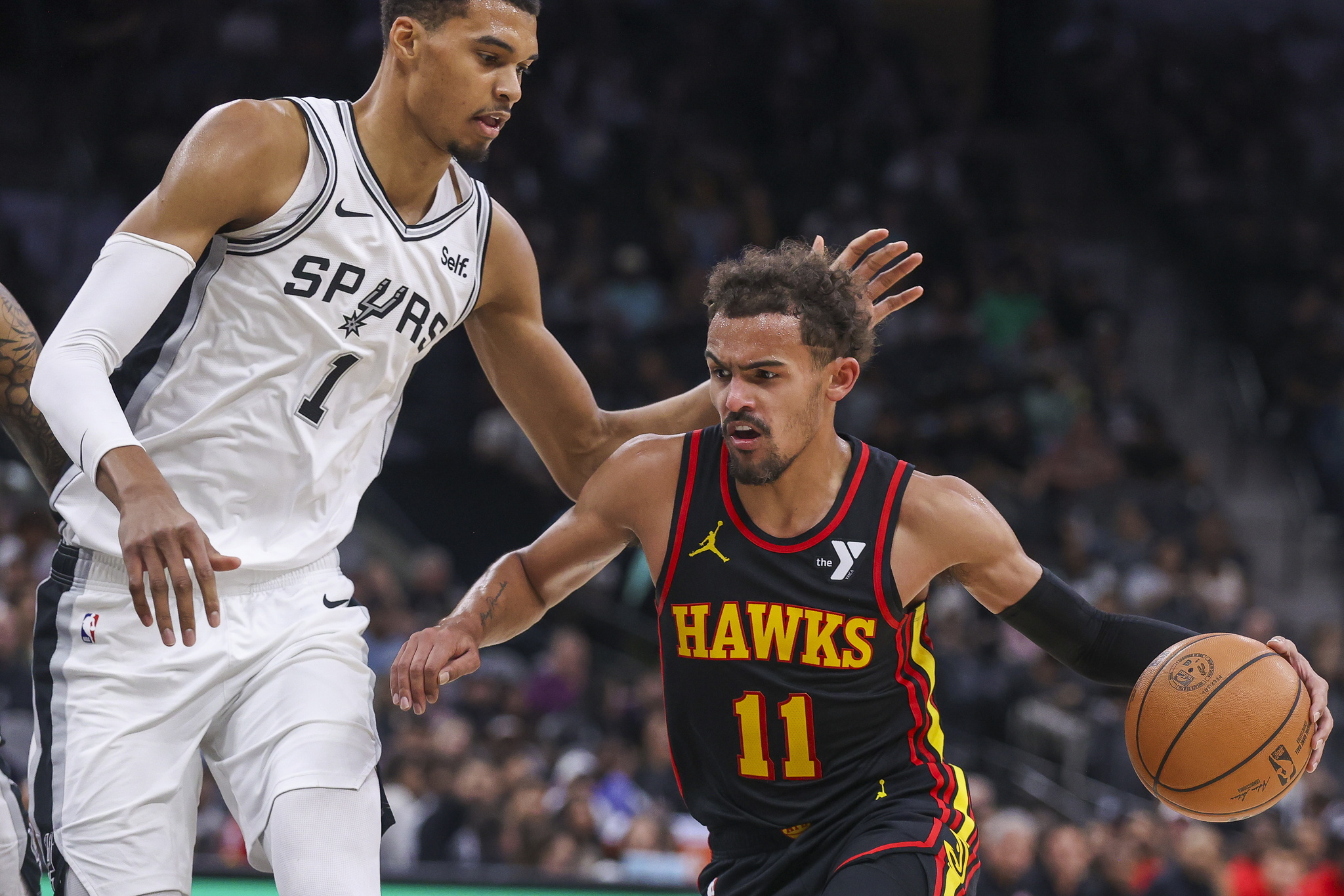 Atlanta Hawks guard Trae Young in action against San Antonio Spurs center Victor Wembanyama