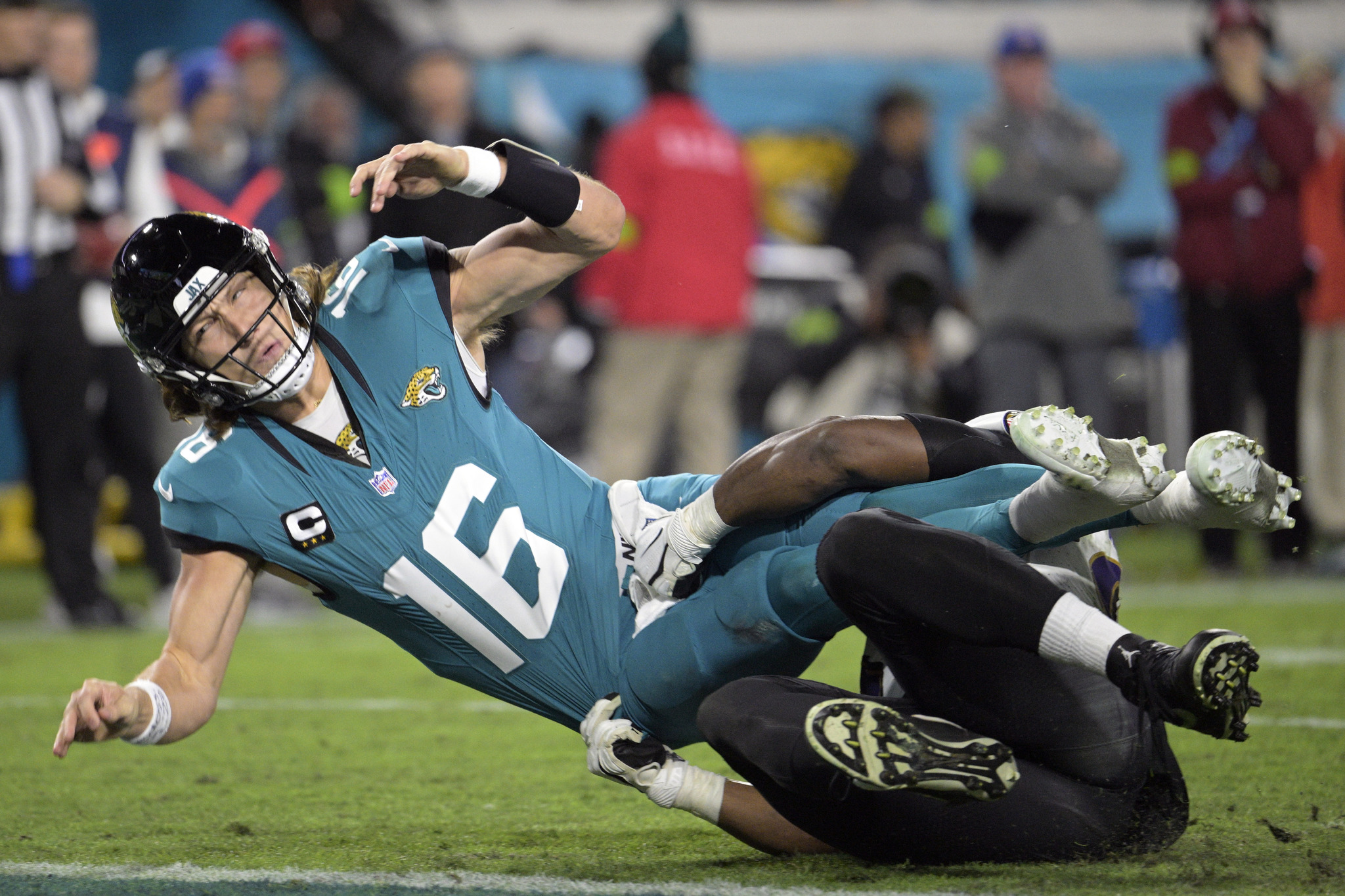 Jacksonville Jaguars quarterback Trevor Lawrence is brought down