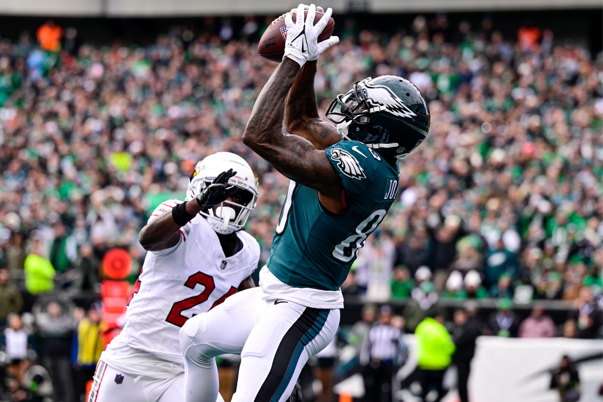 Jones (right) catching his first touchdown of the half against Arizona.