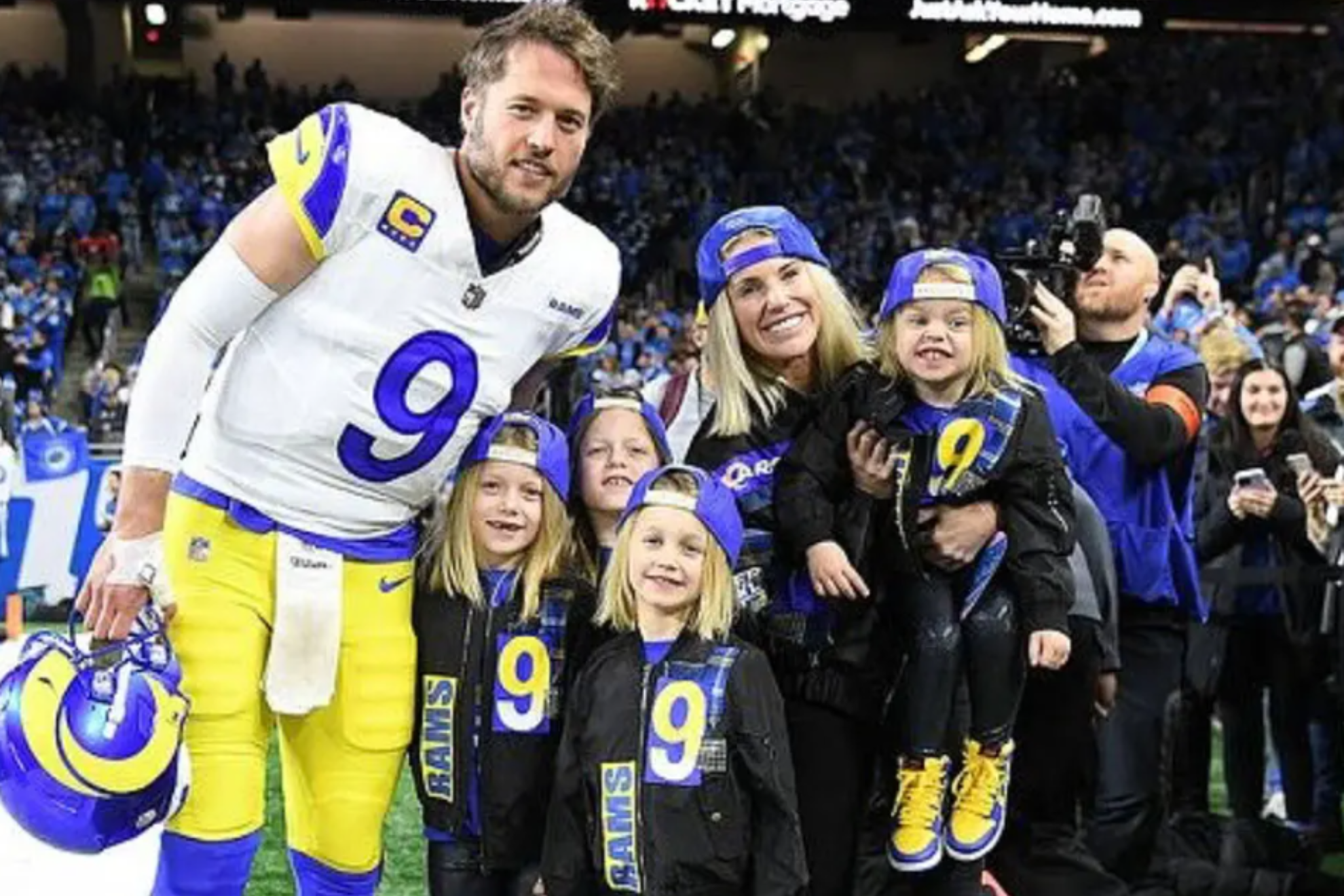 The Stafford family poses at Ford Field.