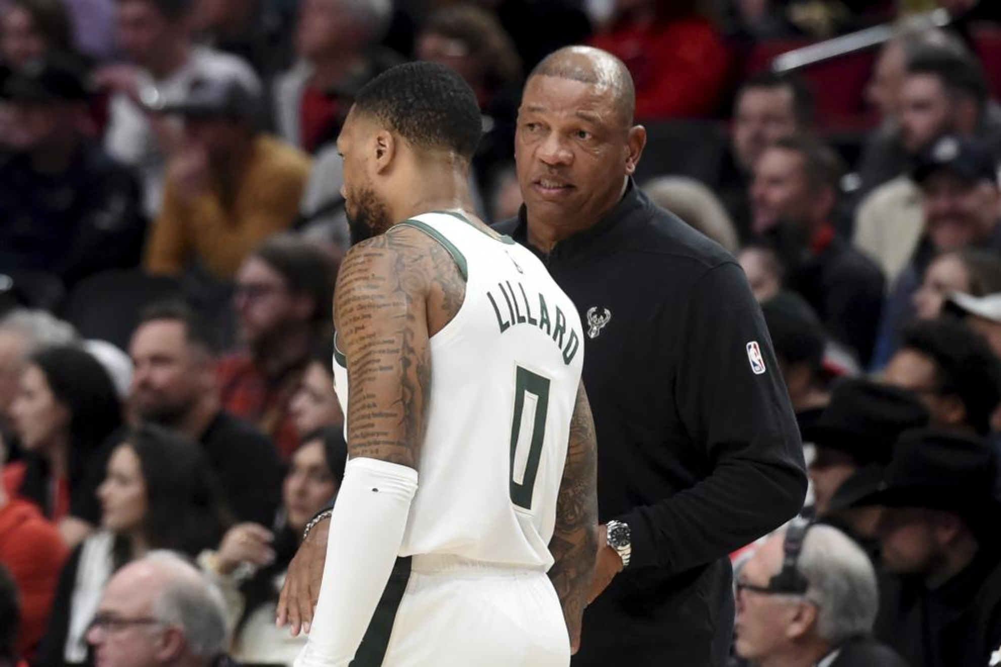 Doc Rivers speaks with Damian Lillard.