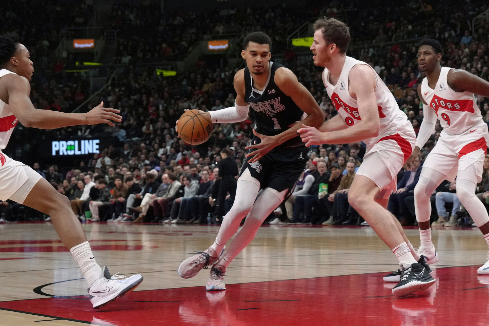 Wembanyama drives into the teeth of the Raptors defense.