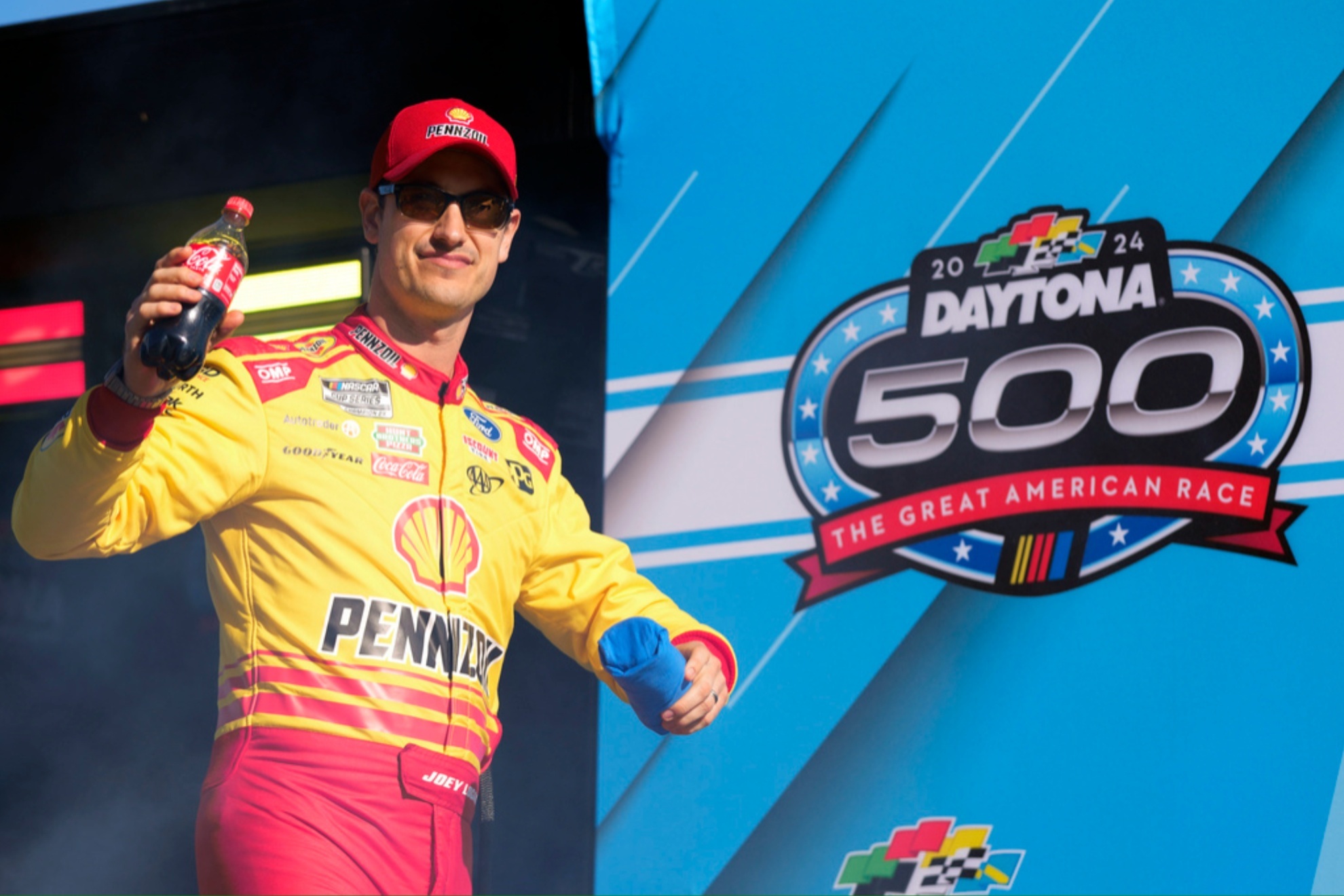 Joey Logano waves to fans during driver introductions of the NASCAR Daytona 500.