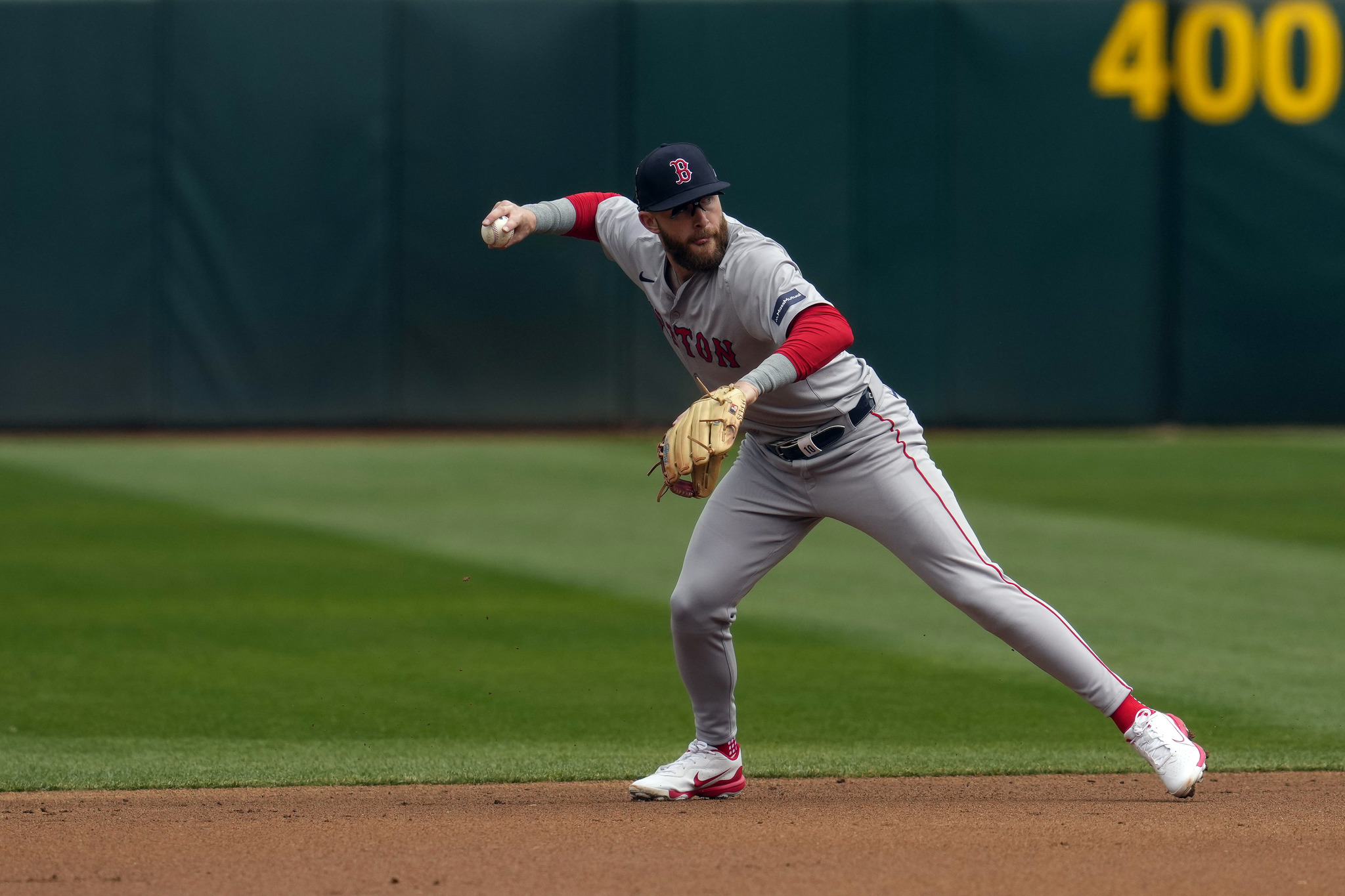 Boston Red Sox shortstop Trevor Story throws to first