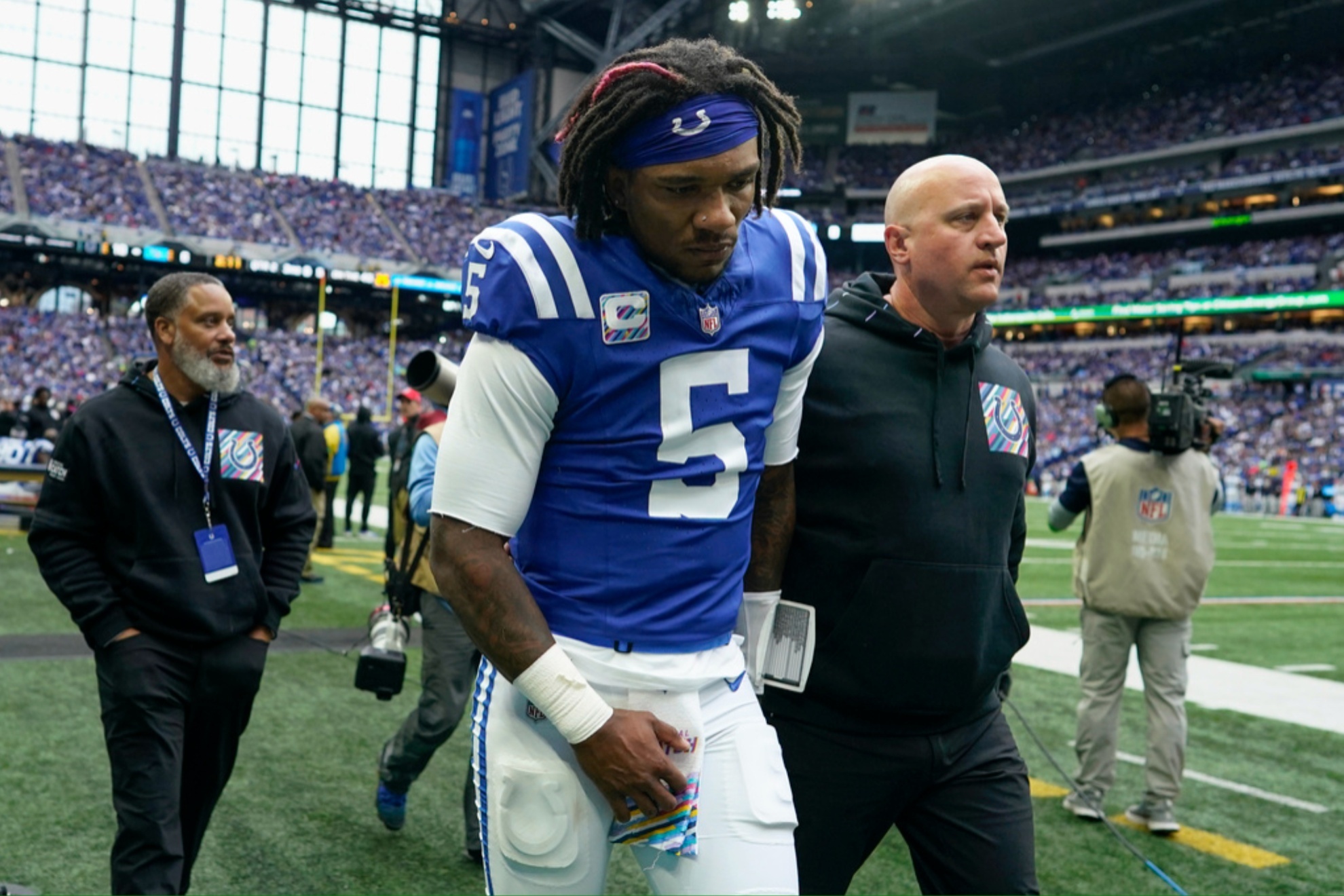 Anthony Richardson (5) leaves the field after being injured during the game against the Tennessee Titans.