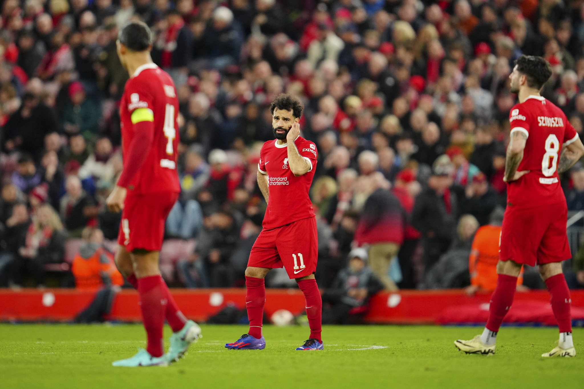 Liverpool players react after going 3-0 down.