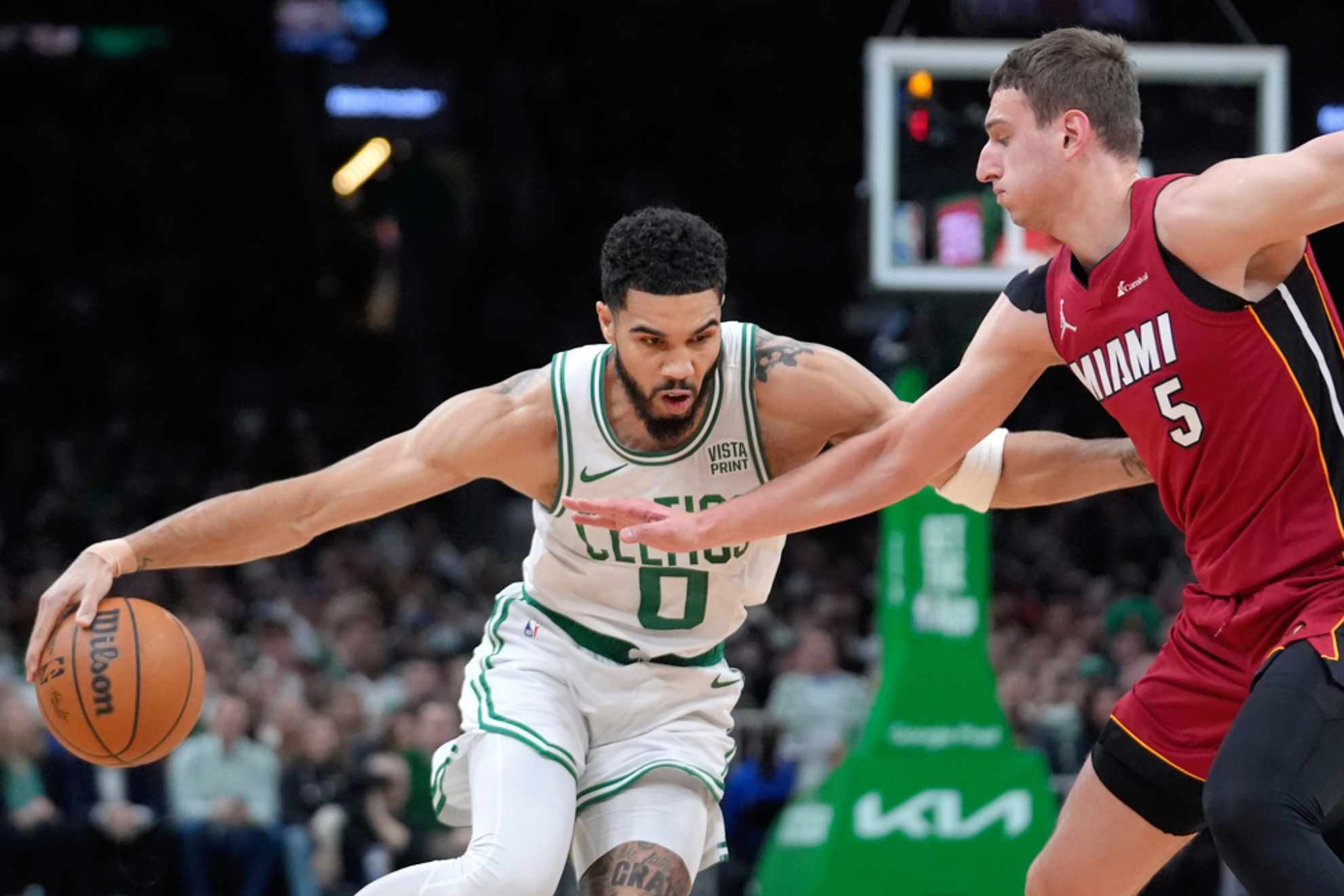 Jayson Tatum drives past Miami Heat forward Nikola Jovic /