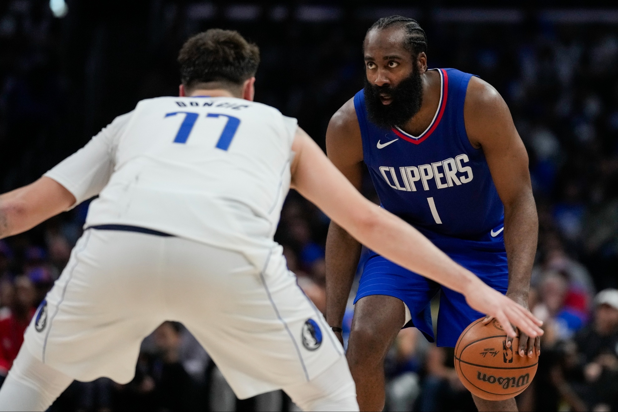 Dallas Mavericks guard Luka Doncic (77) and LA Clippers guard James Harden (1).