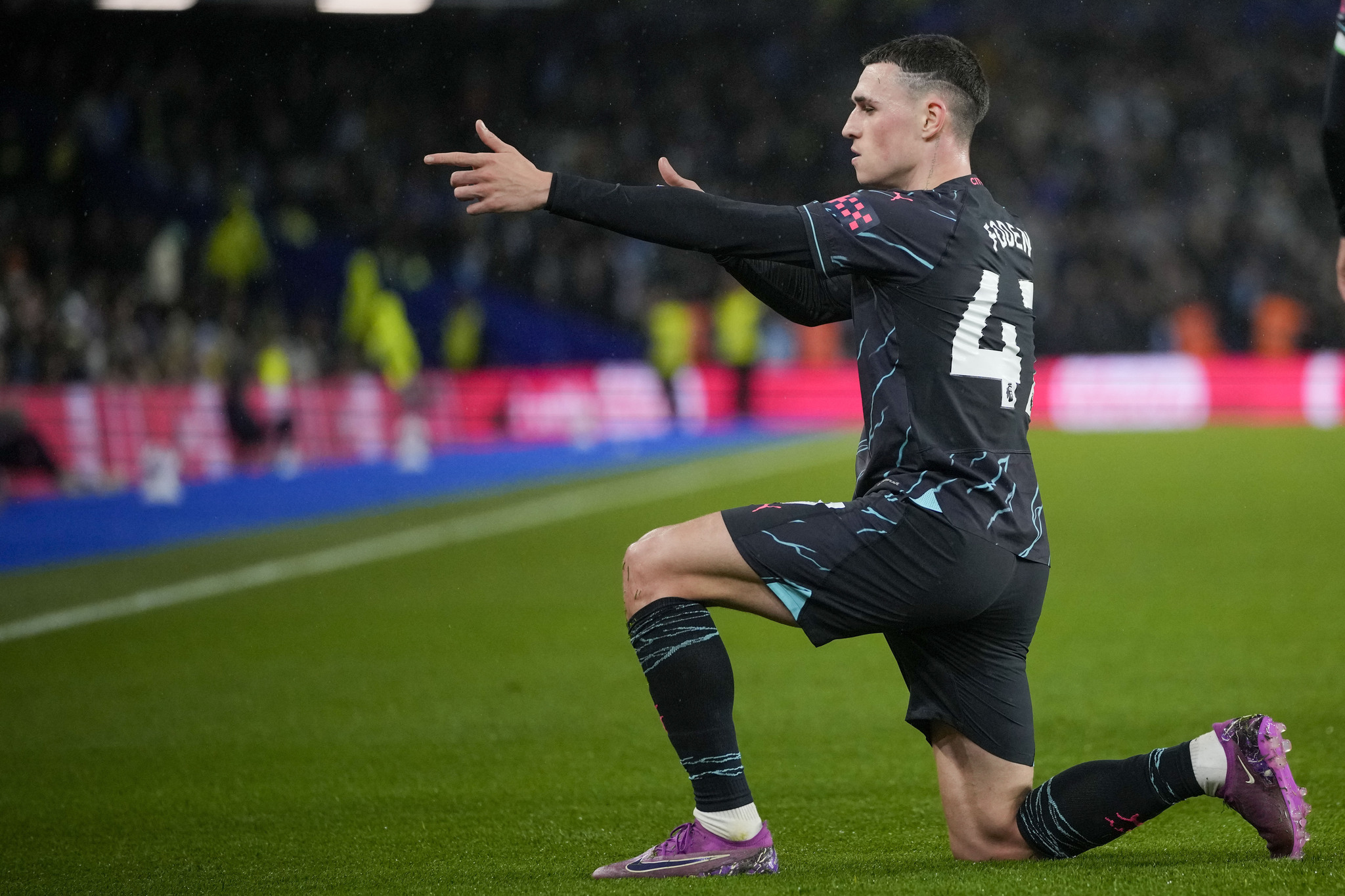 Manchester Citys Phil Foden celebrates after scoring his sides third goal