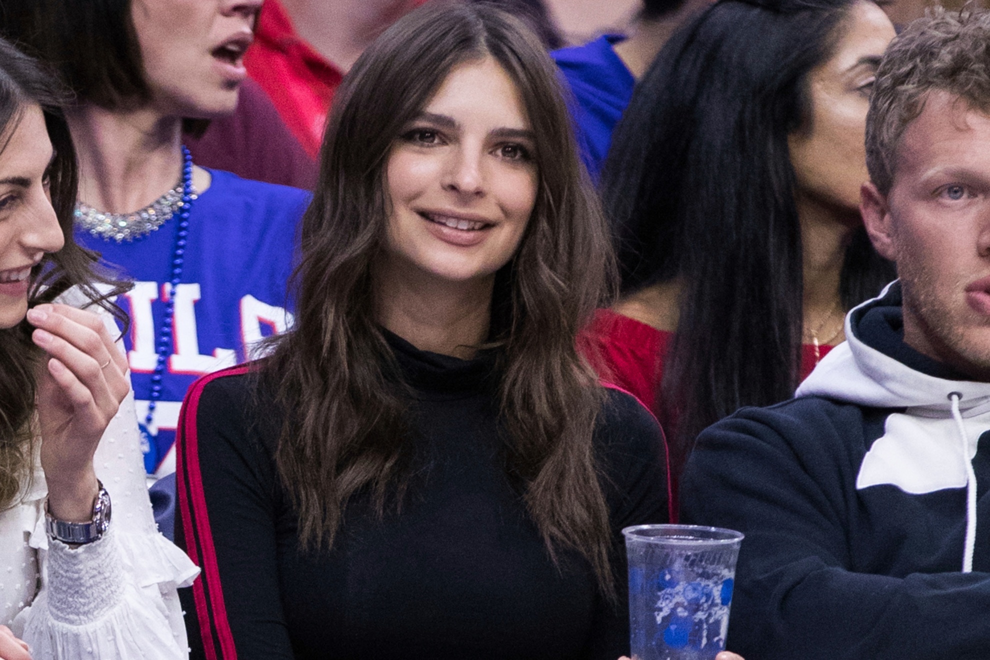 Actress Emily Ratajkowski watches an NBA basketball game between the Cleveland Cavaliers and the Philadelphia 76ers, Friday, April 6, 2018, in Philadelphia. The 76ers won 132-130. (AP Photo/Chris Szagola)