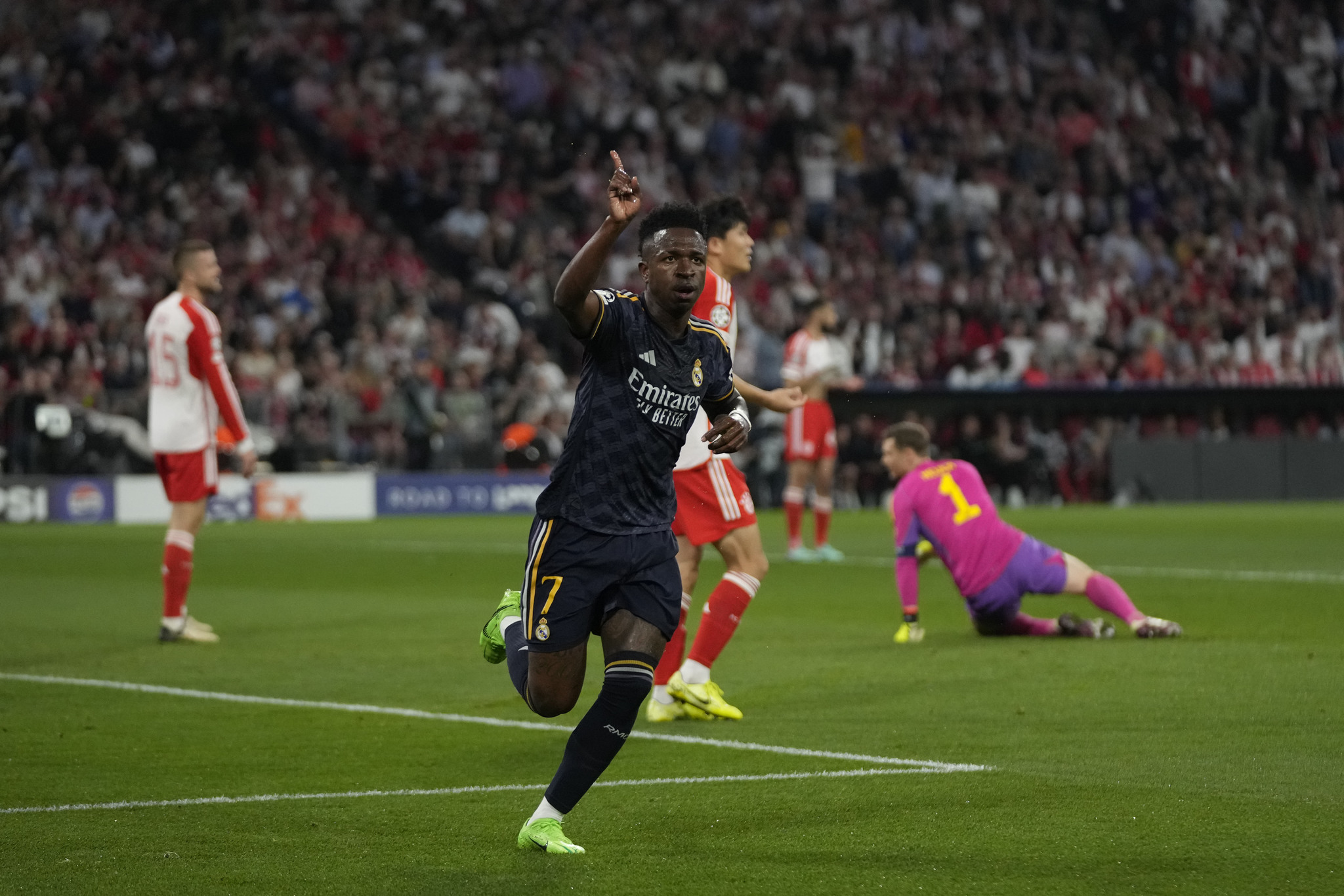 Vinicius Junior celebrates after scoring the opening goal of the match