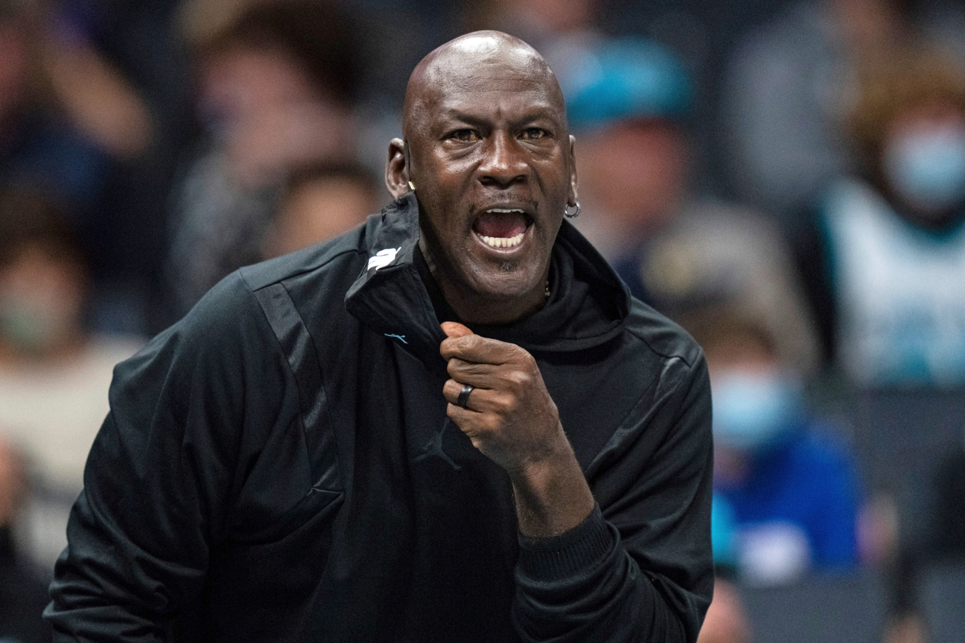 Michael Jordan looks on during the first half of an NBA basketball game between the Charlotte Hornets and the New York Knicks in Charlotte, N.C., Nov. 12, 2021. (AP Photo/Jacob Kupferman, File)