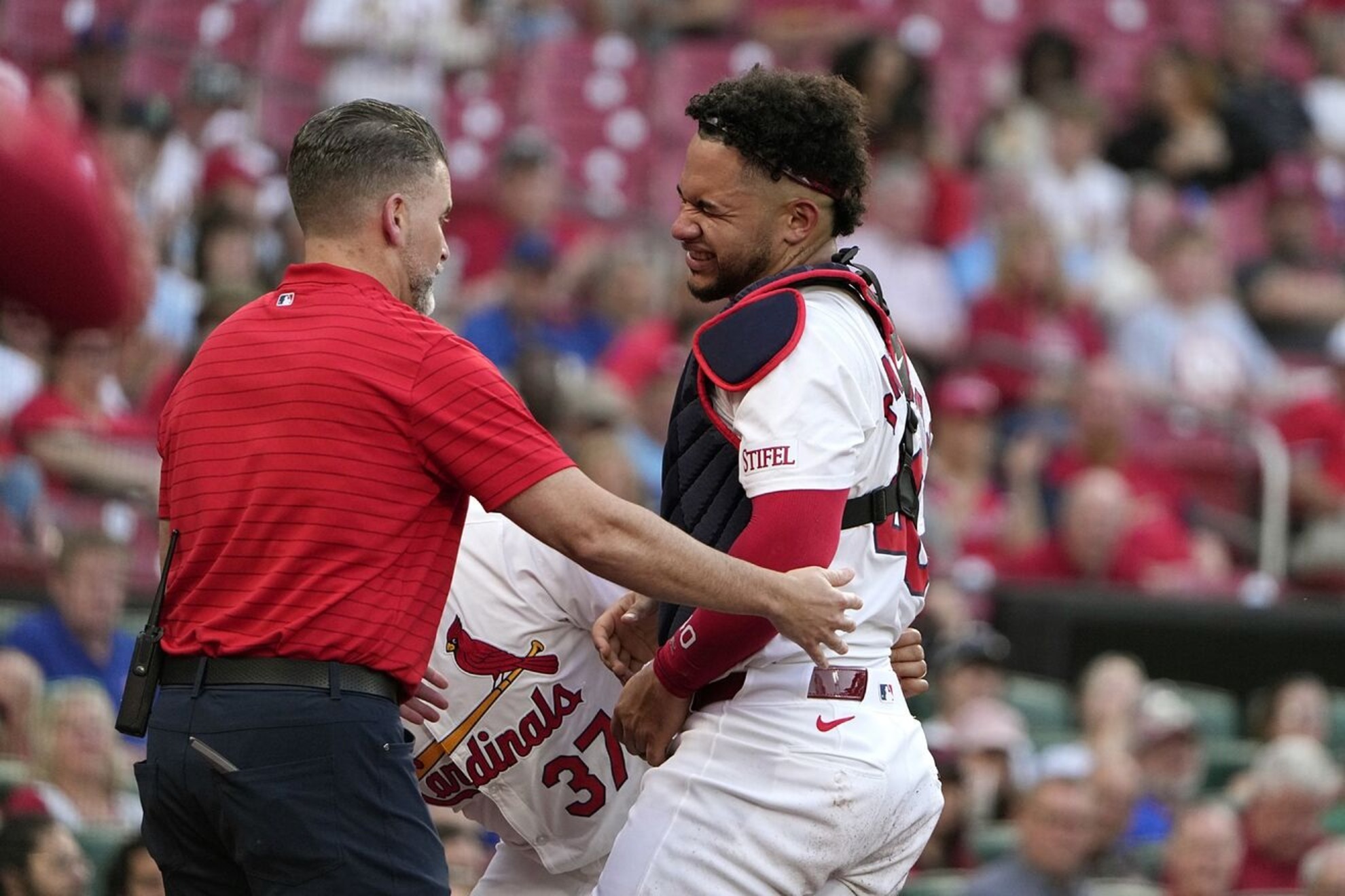 Willson Contreras pain after being hit by J.D. Mart�nezs bat.