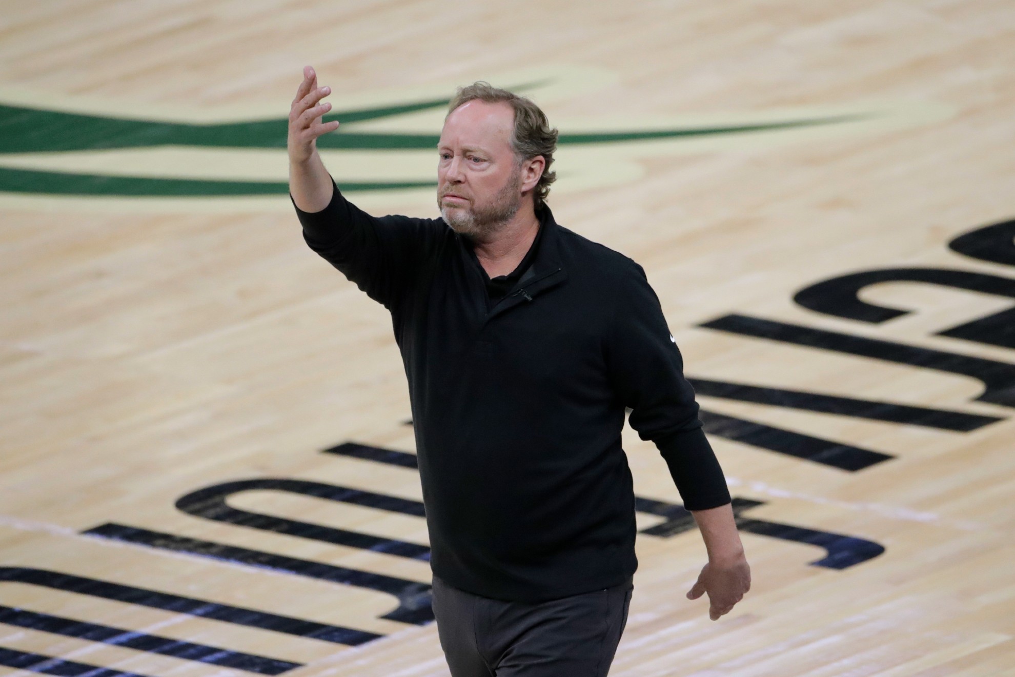 Milwaukee Bucks coach Mike Budenholzer directs the team during the first half against the Phoenix Suns in Game 4.