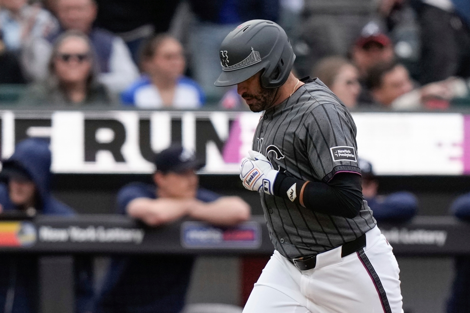 New York Mets J.D. Martinez runs the bases after hitting a home run during the ninth inning of a baseball game against the Atlanta Braves, Saturday, May 11, 2024, in New York.