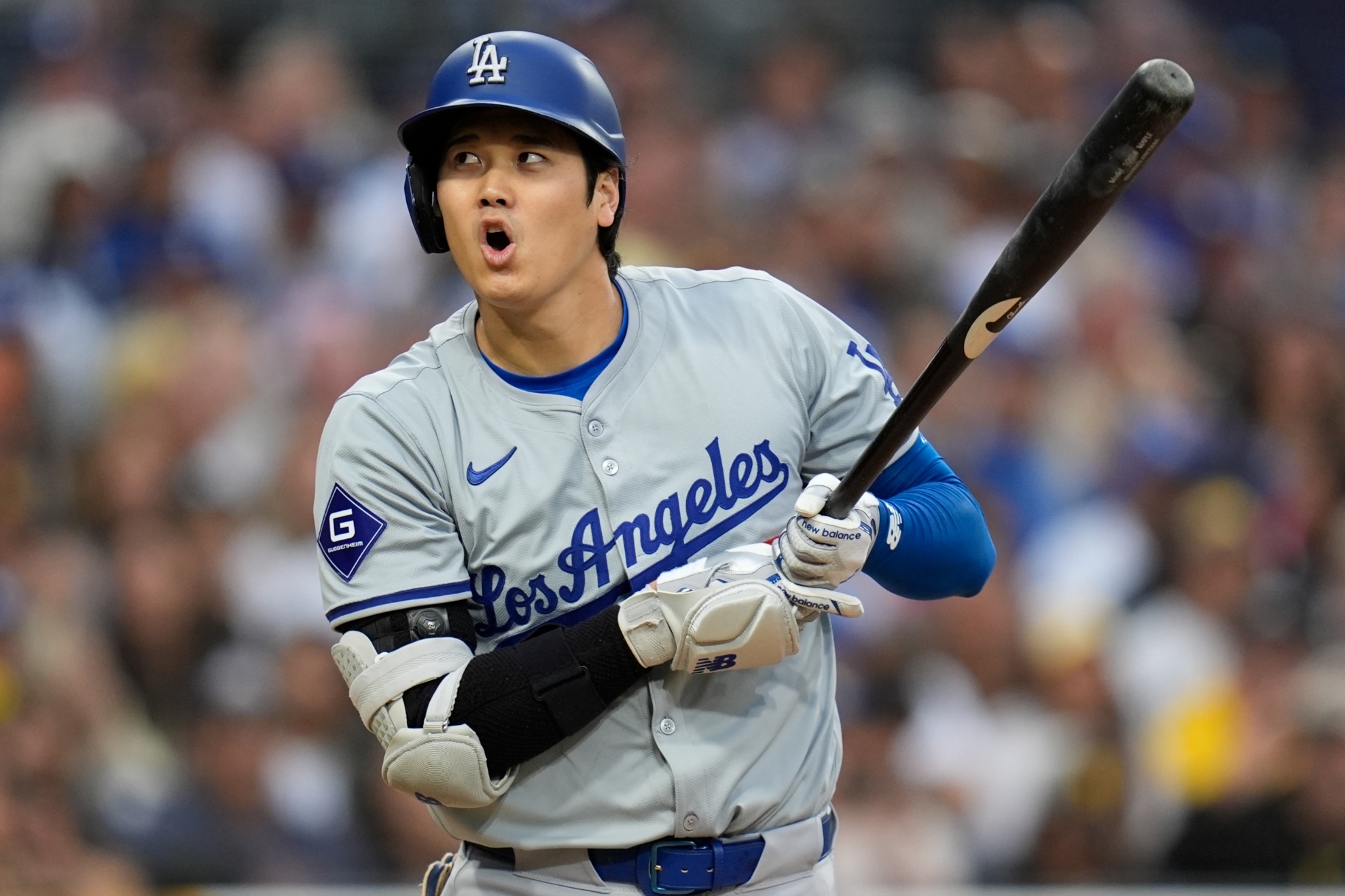 Los Angeles Dodgers Shohei Ohtani reacts to an inside pitch during the sixth inning of a baseball game against the San Diego Padres, Saturday, May 11, 2024, in San Diego. (AP Photo/Gregory Bull)