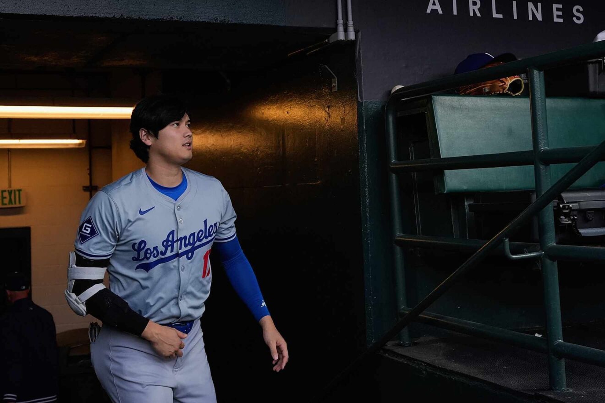 Shohei Ohtani enters the dugout before a baseball game against the San Francisco Giants