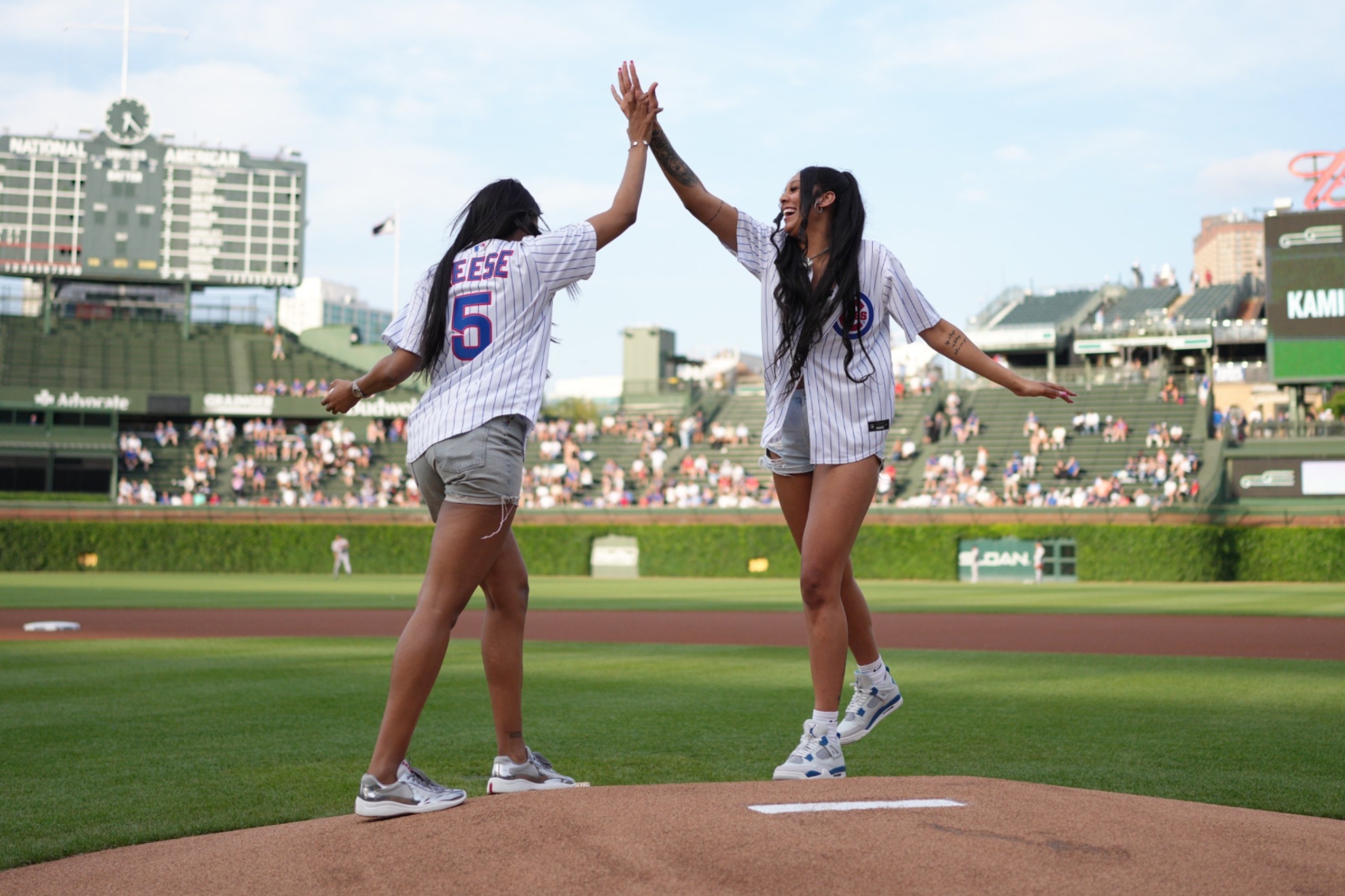 Chicago Skys Angel Reese and Kamila Cardoso threw the first pitch at Wrigly Field on Tuesday