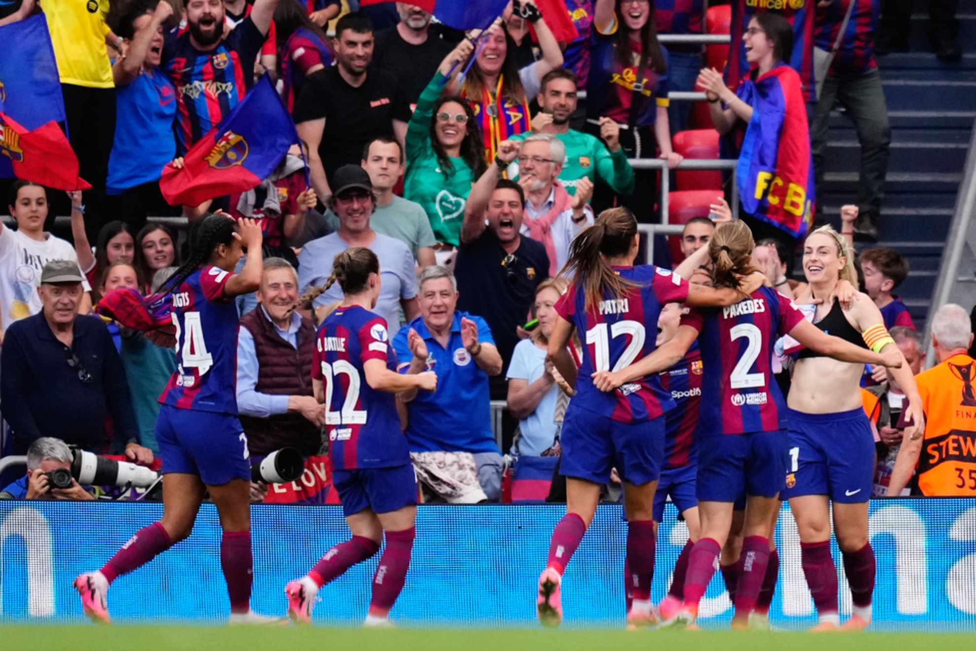 Barcelonas Alexia Putellas, right, is congratulated after scoring her sides 2nd goal during the womens Champions League final /