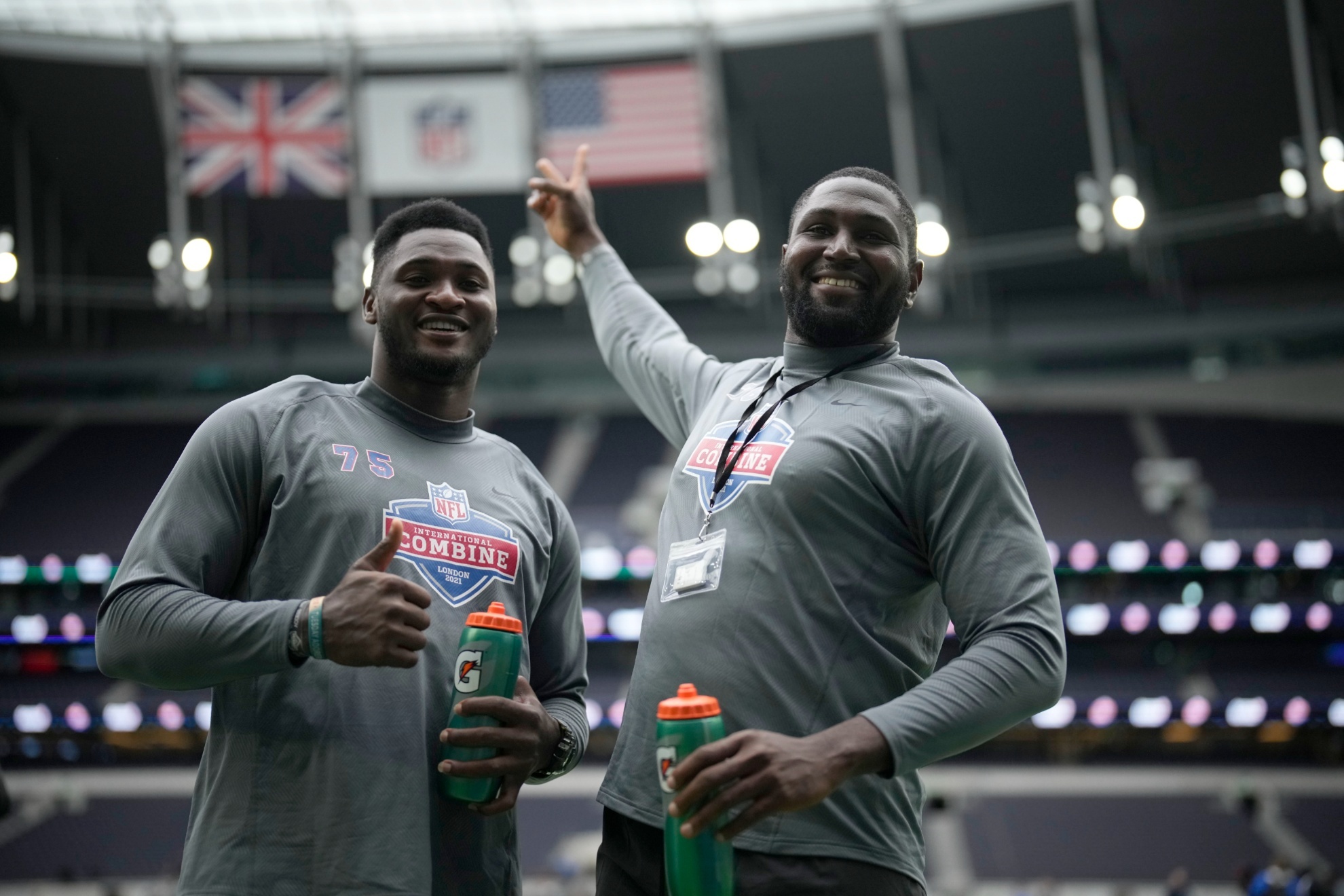 Up Rise Academys offensive linemen Haggai Chison Noubuis, left, and Mbaeteka Chigbo Roy, both from Nigeria, pose for photographs after taking part in the NFL International Combine at the Tottenham Hotspur Stadium in London, Tuesday, Oct. 12, 2021. International athletes on Tuesday took part in a series of tests in front of NFL evaluators for a potential position in the NFLs International Player Pathway programme. (AP Photo/Matt Dunham)