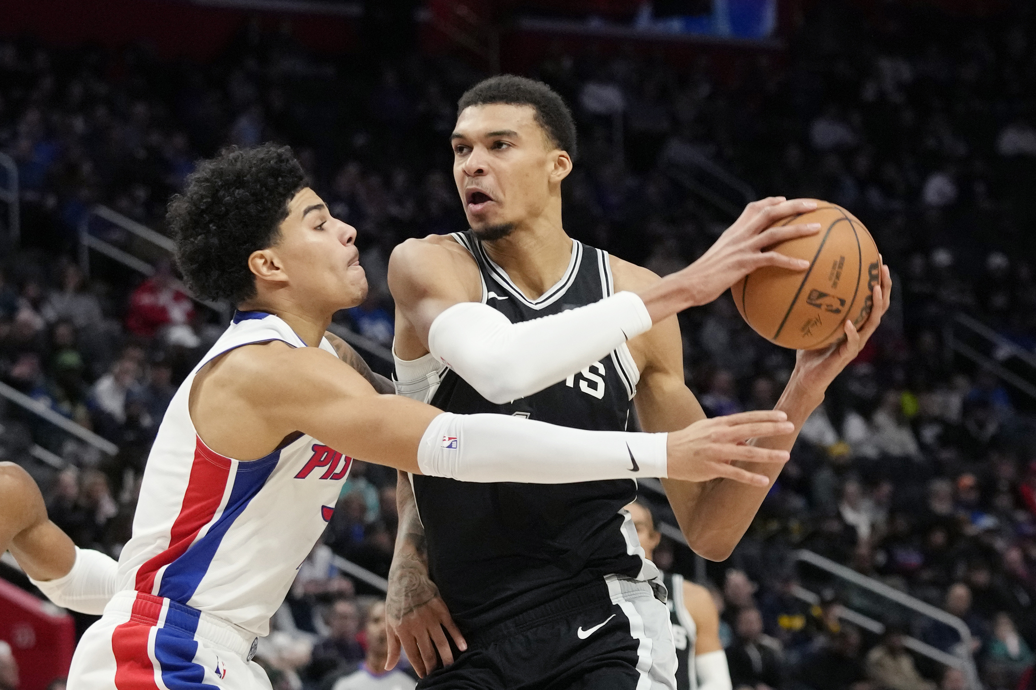 San Antonio Spurs center Victor Wembanyama is defended by Detroit Pistons guard Killian Hayes