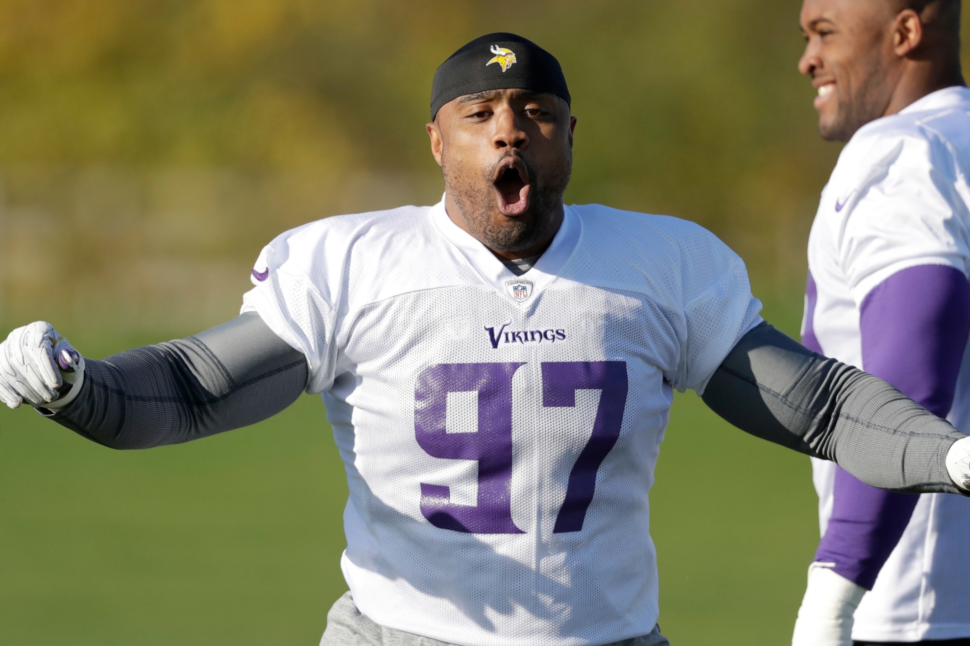 Minnesota Vikings defensive end Everson Griffen reacts to music being played as he takes part in an NFL training session at the London Irish rugby team training ground in the Sunbury-onThames suburb of south west London, Friday, Oct. 27, 2017. The Minnesota Vikings are preparing for an NFL regular season game against the Cleveland Browns in London on Sunday. (AP Photo/Matt Dunham)